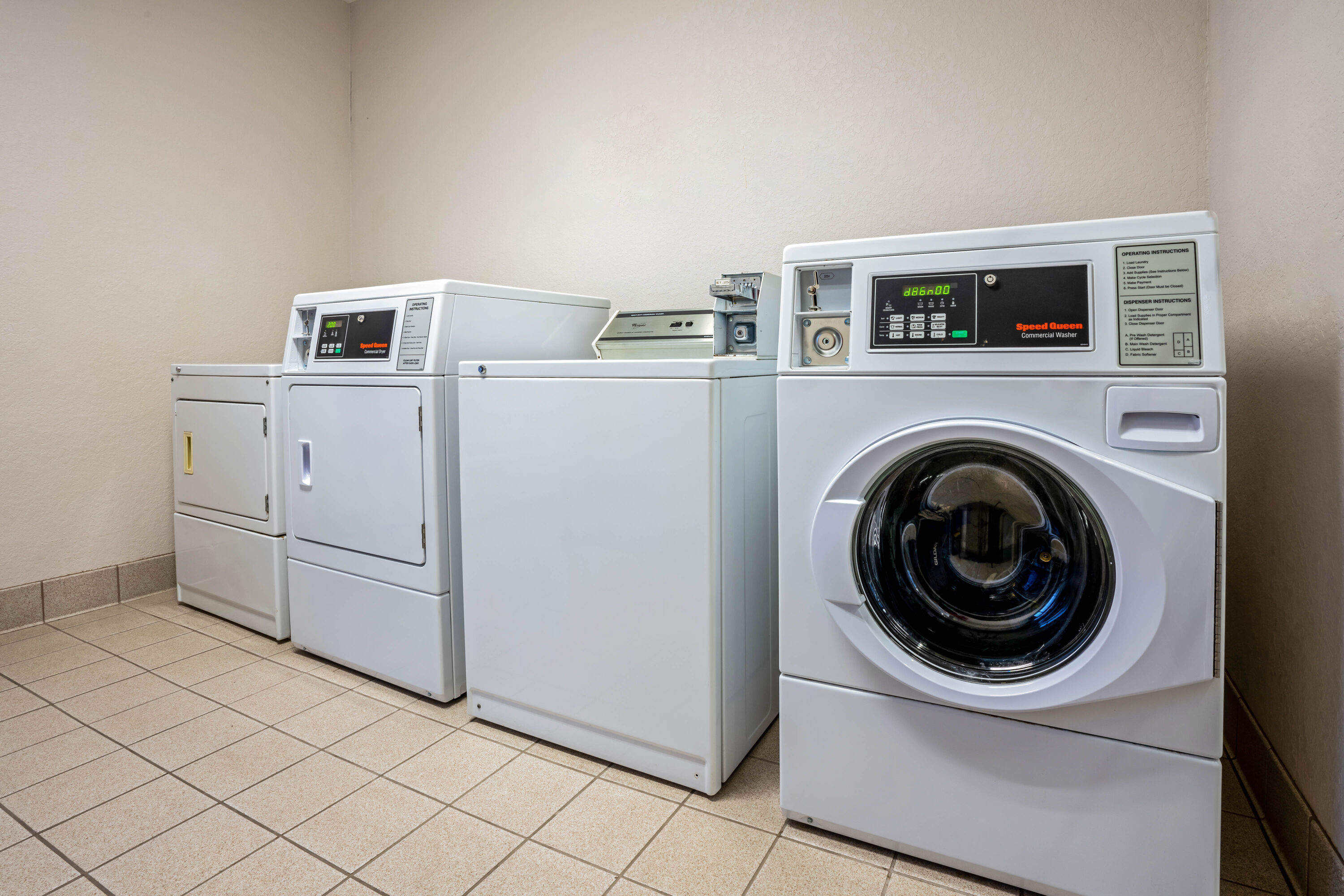 Laundry facilities at La Quinta Inn & Suites by Wyndham Conroe in Conroe, Texas