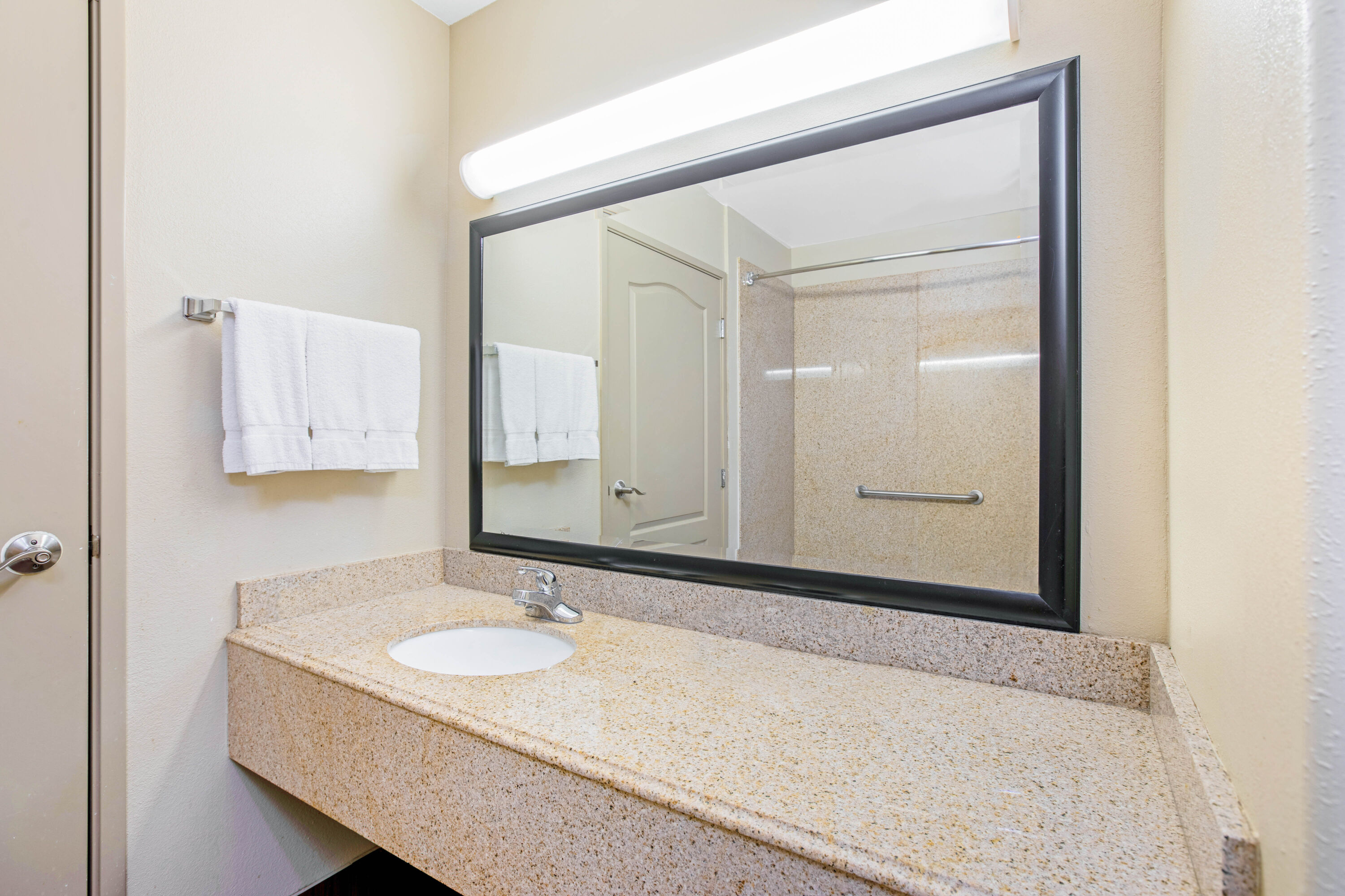 Guest room bath at the La Quinta Inn & Suites by Wyndham Corpus Christi Airport in Corpus Christi, Texas