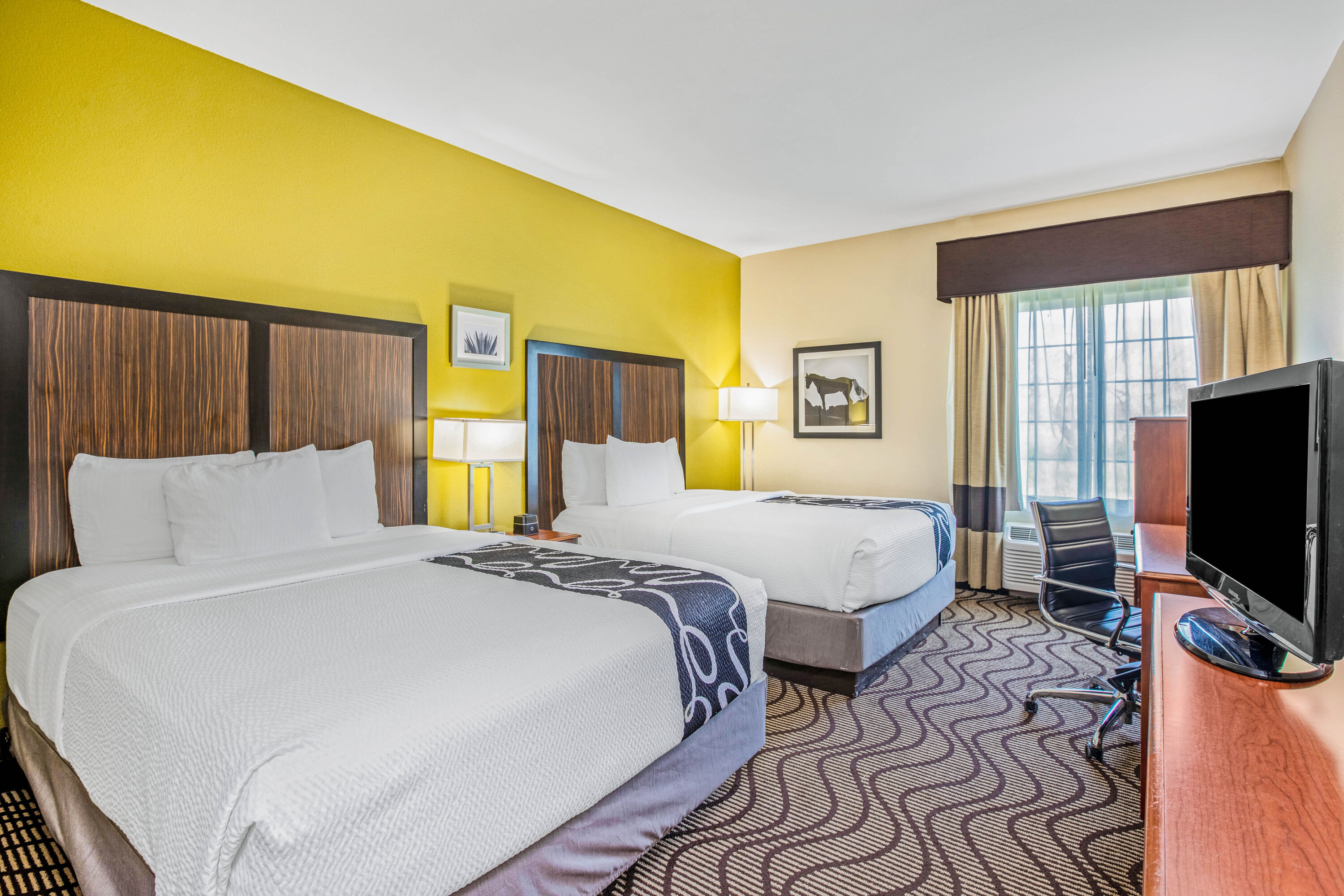 Guest room at the La Quinta Inn & Suites by Wyndham Corpus Christi Northwest in Corpus Christi, Texas