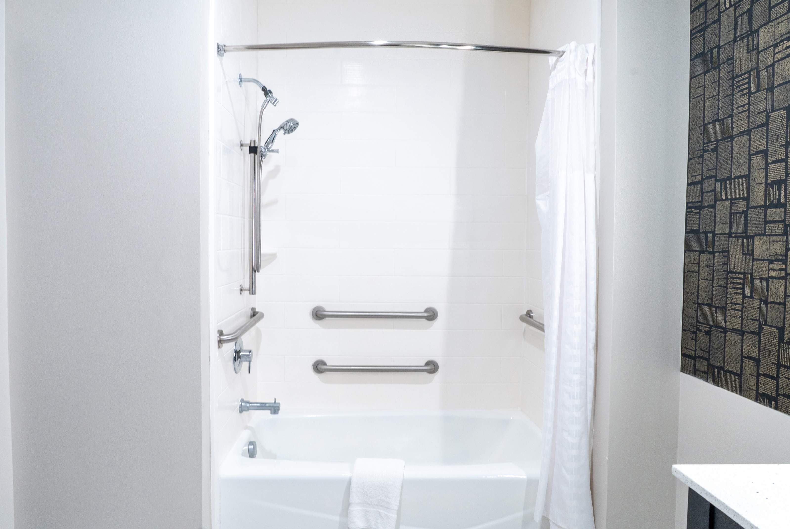 Guest room bath at the La Quinta Inn & Suites by Wyndham Corpus Christi Southeast in Corpus Christi, Texas