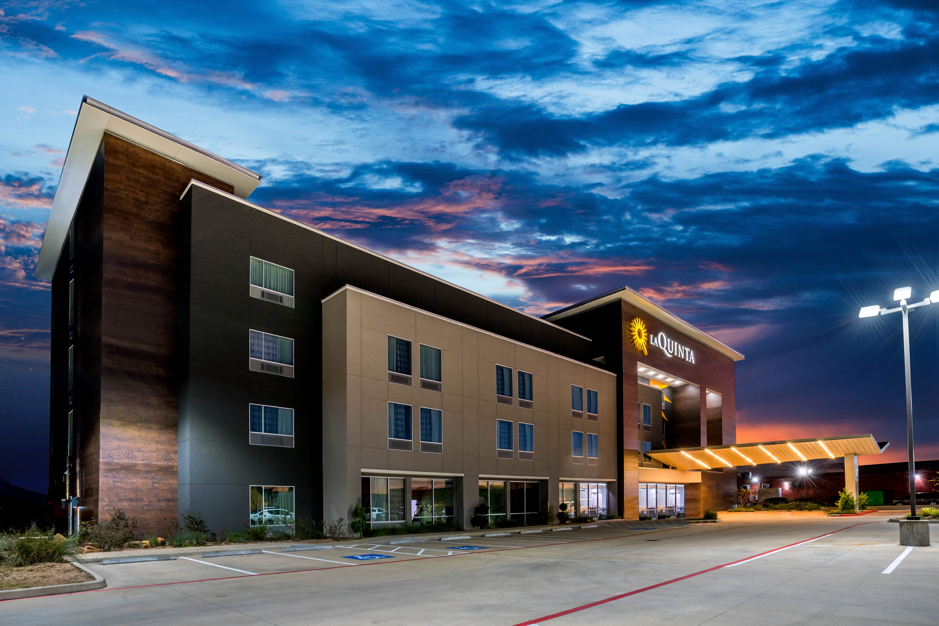 Exterior Dusk Image of La Quinta Inn & Suites by Wyndham Houston Cypress hotel in Cypress, Texas