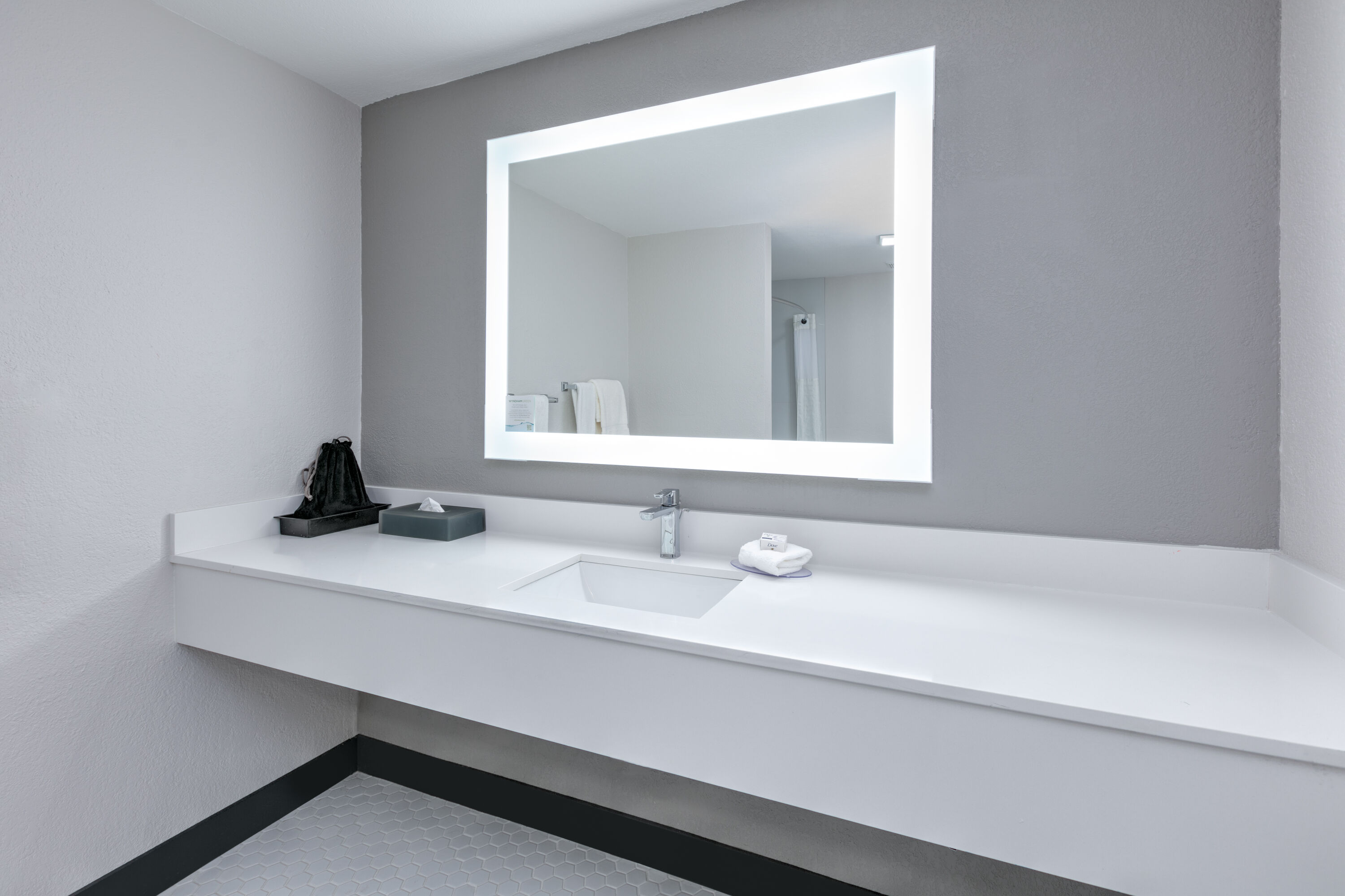 Guest room bath at the La Quinta Inn by Wyndham Dallas Uptown in Dallas, Texas