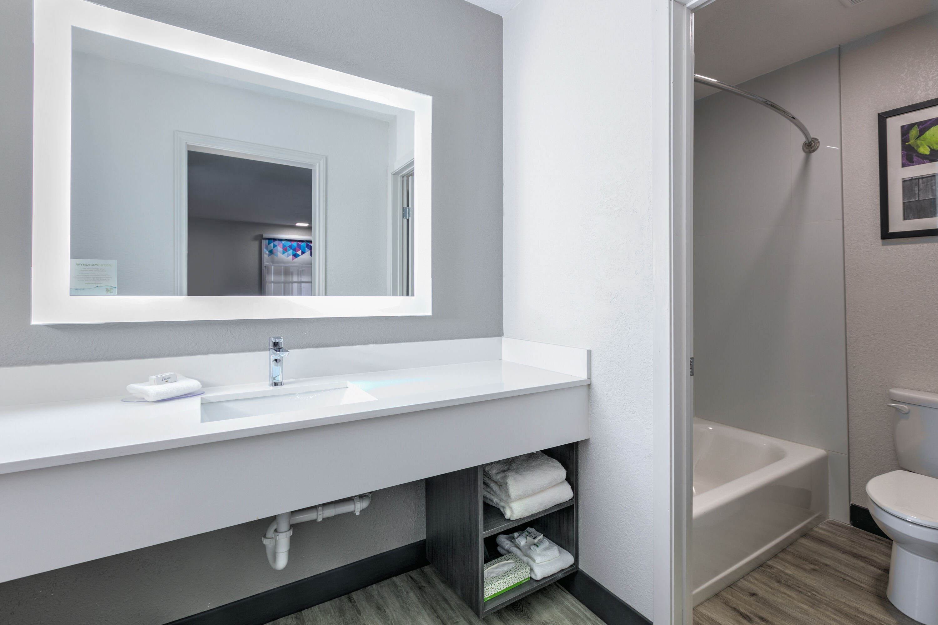 Guest room bath at the La Quinta Inn by Wyndham Dallas Uptown in Dallas, Texas