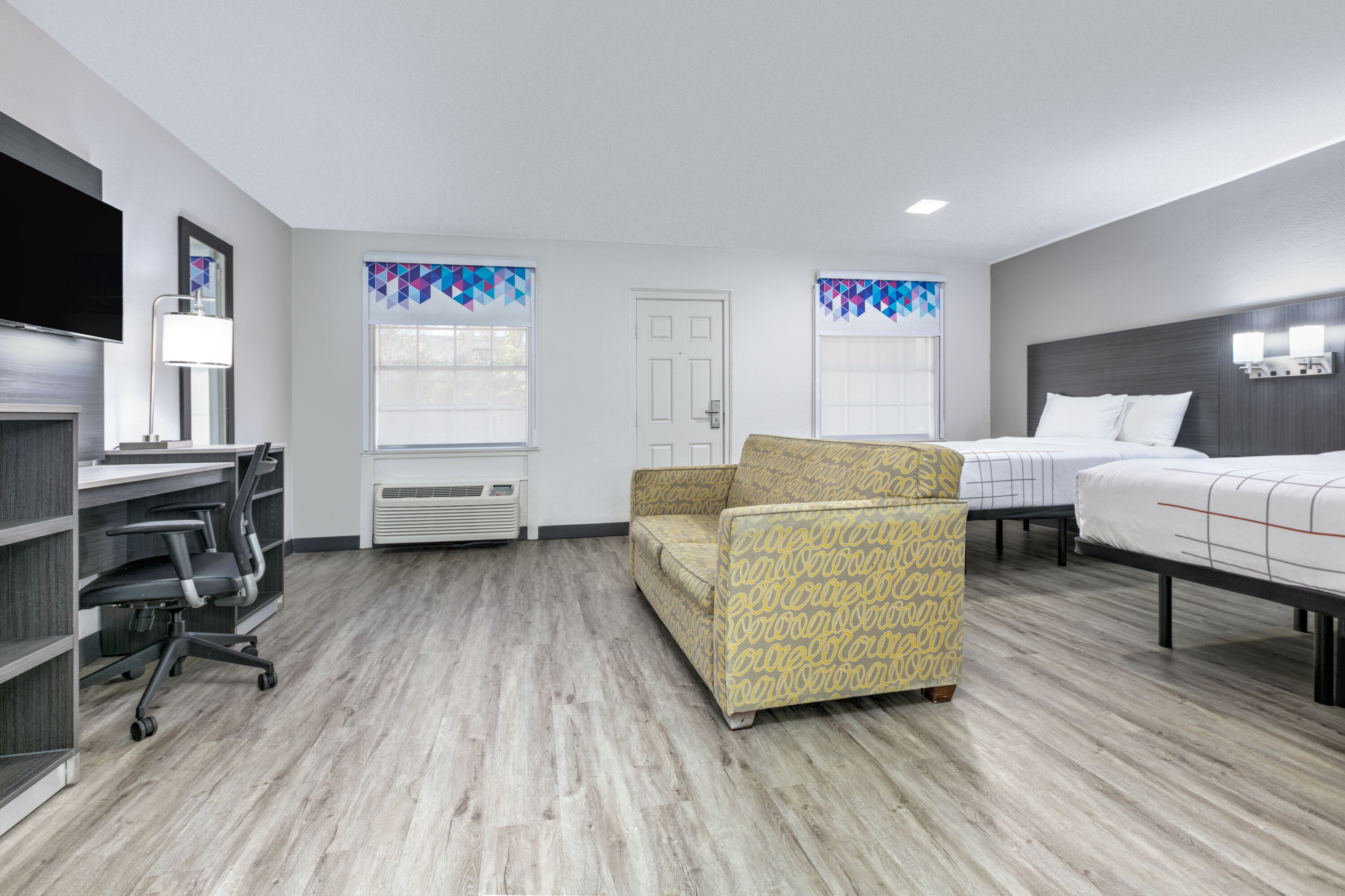 Guest room at the La Quinta Inn by Wyndham Dallas Uptown in Dallas, Texas