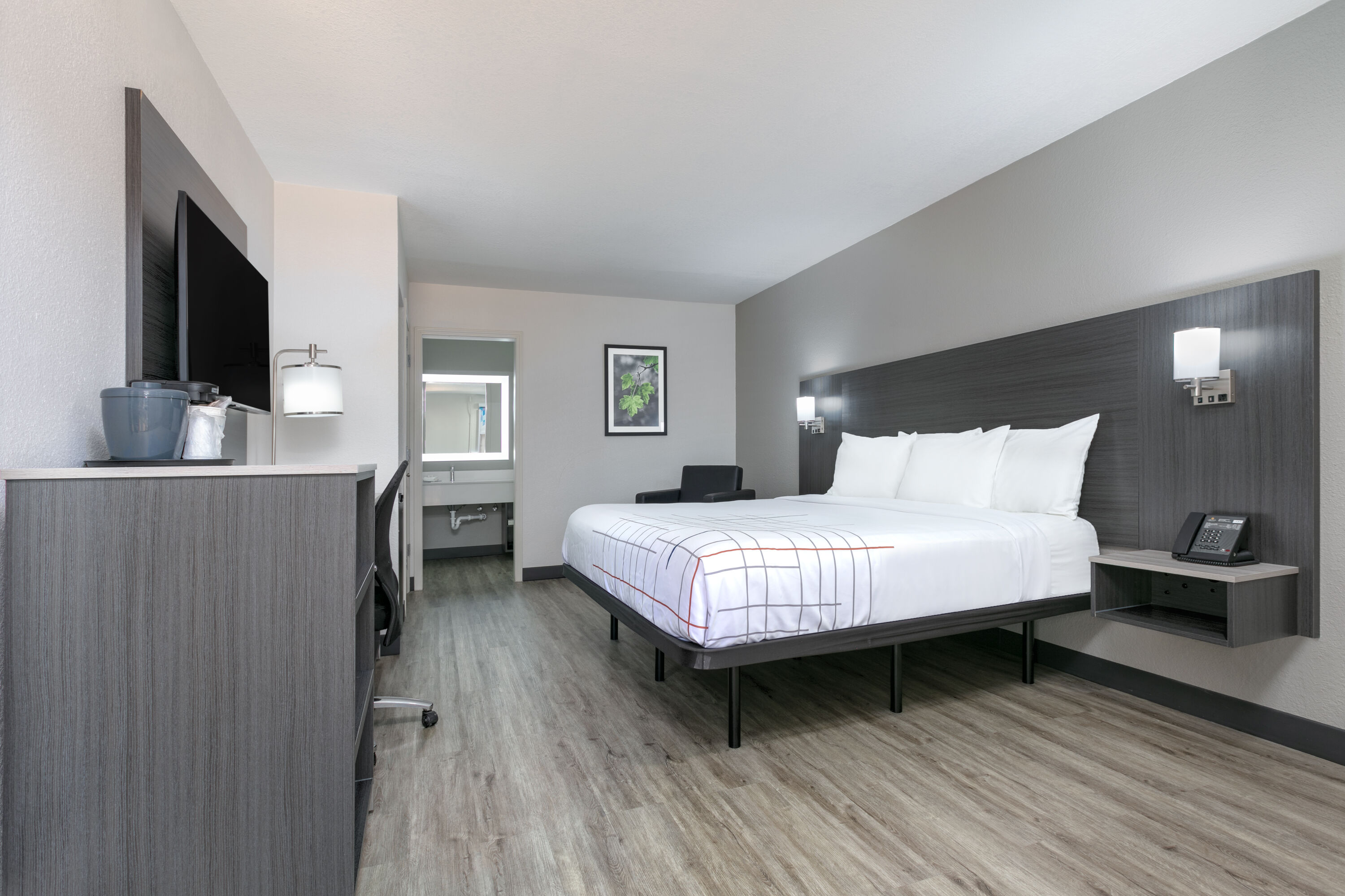 Guest room at the La Quinta Inn by Wyndham Dallas Uptown in Dallas, Texas