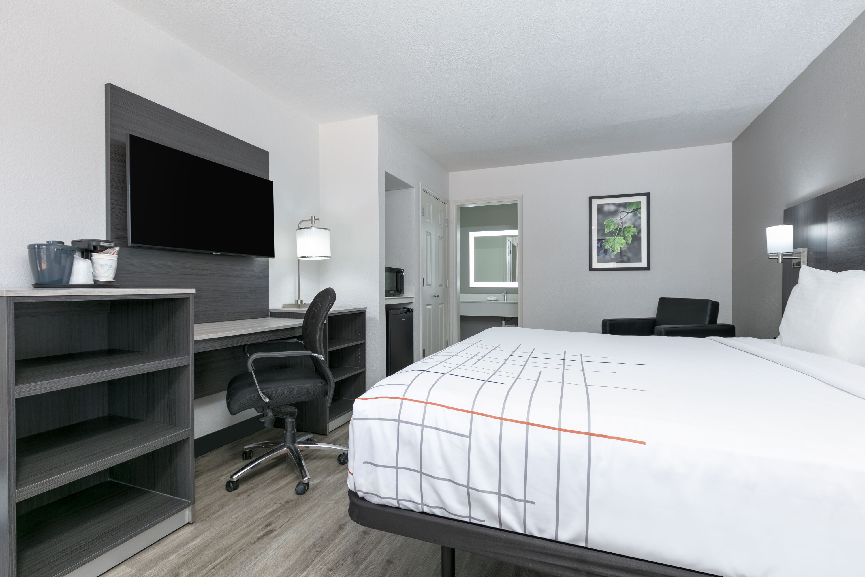 Guest room at the La Quinta Inn by Wyndham Dallas Uptown in Dallas, Texas