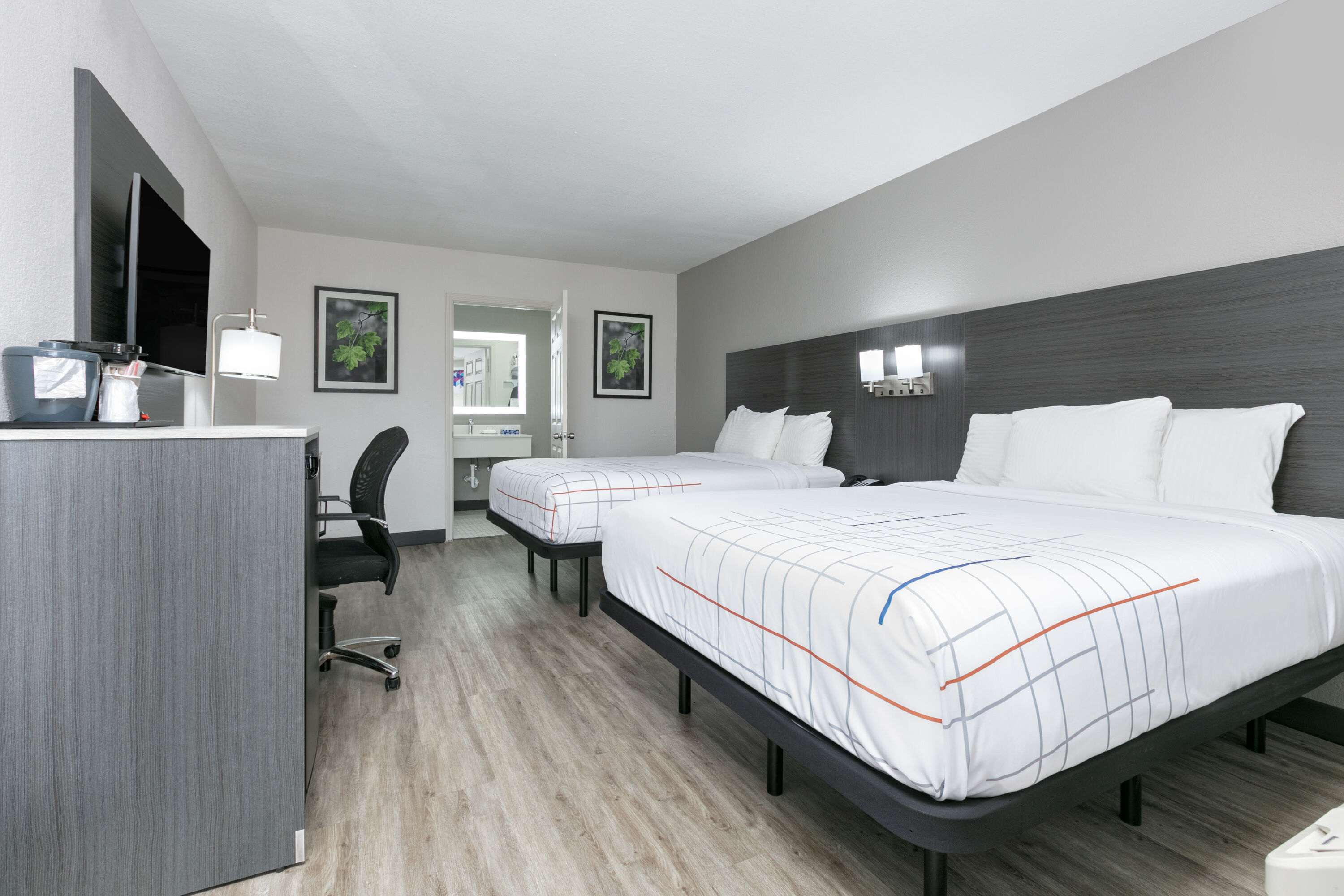 Guest room at the La Quinta Inn by Wyndham Dallas Uptown in Dallas, Texas