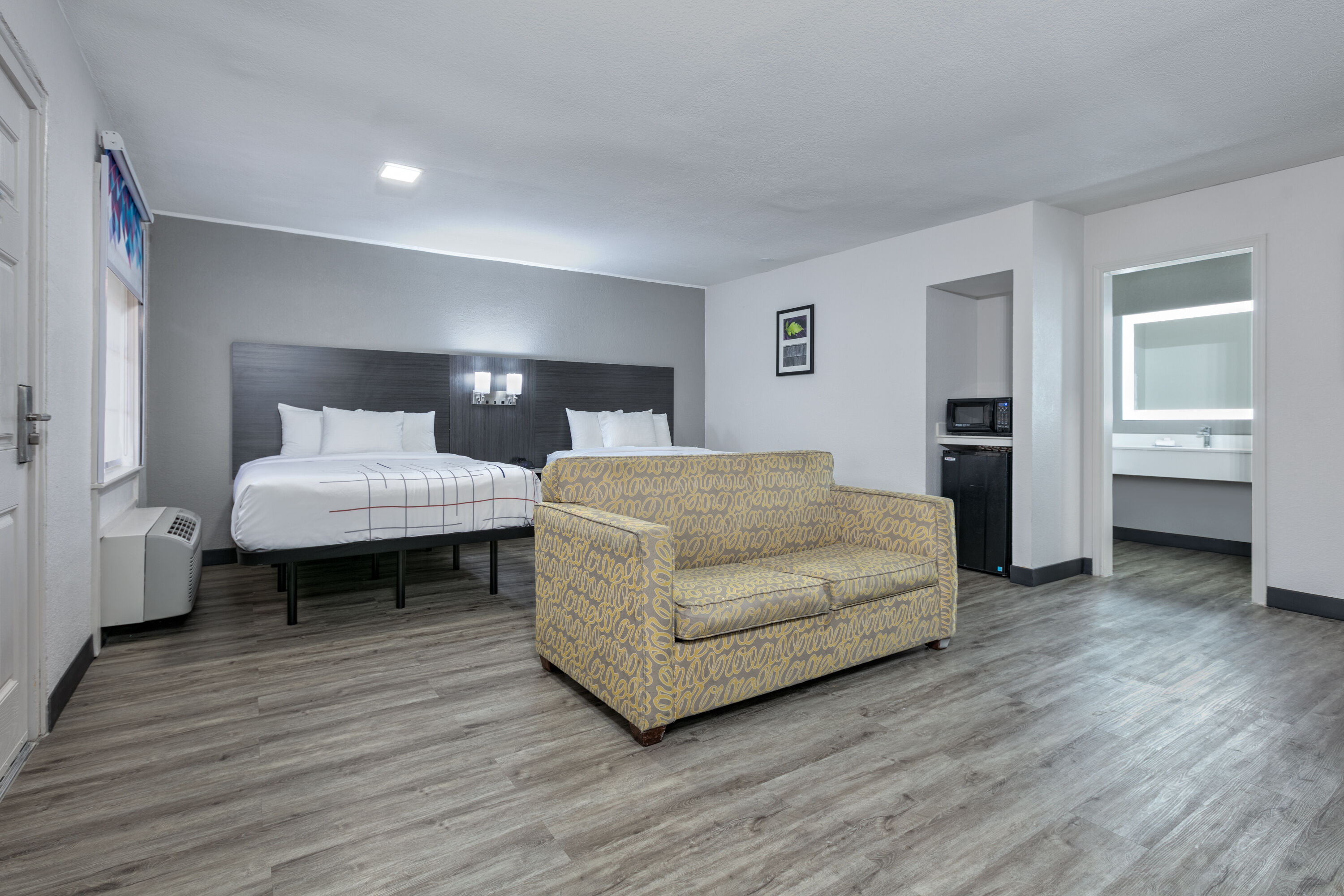 Guest room at the La Quinta Inn by Wyndham Dallas Uptown in Dallas, Texas