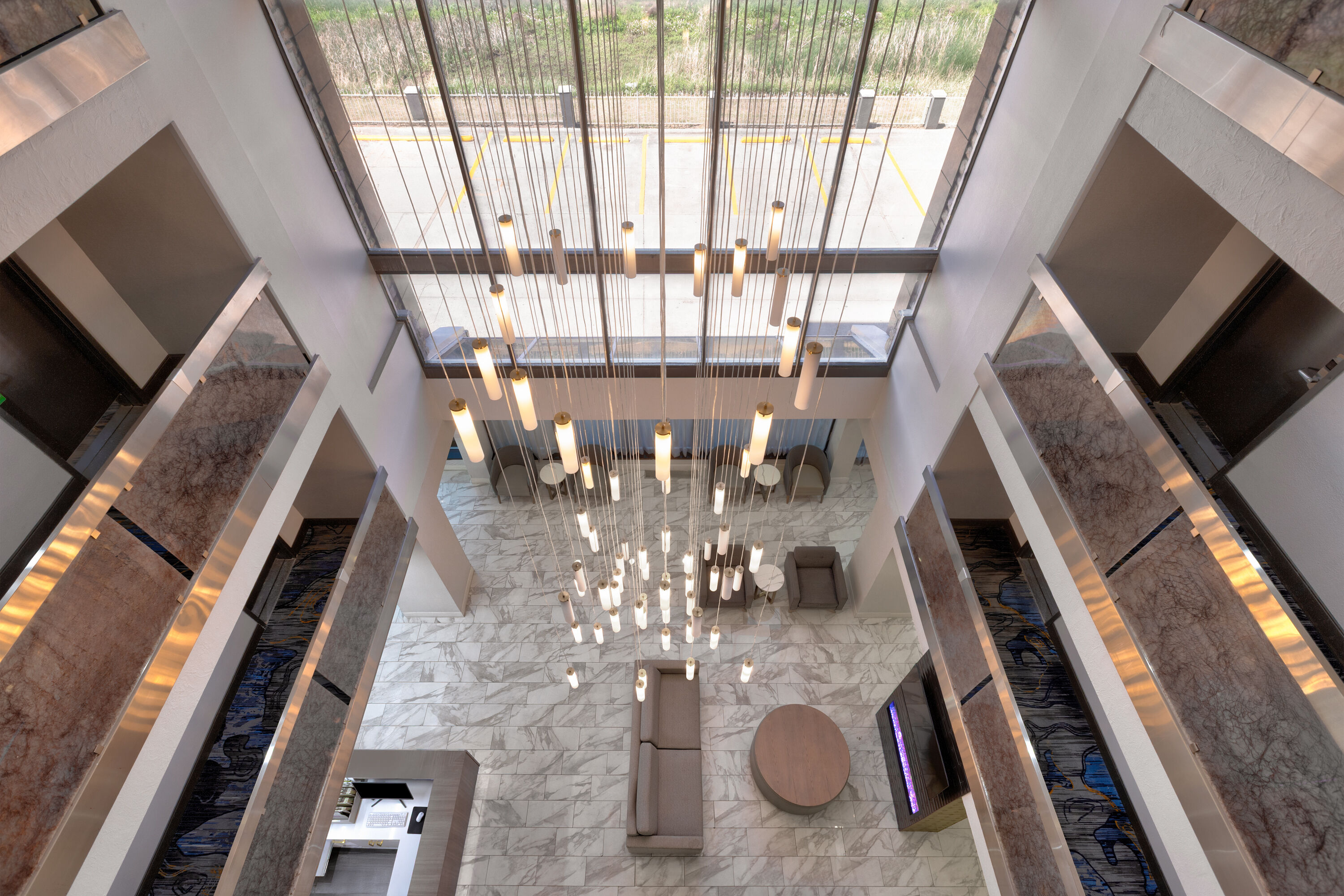 La Quinta Inn & Suites by Wyndham Dallas I-35 Walnut Hill Ln lobby atrium in Dallas, Texas