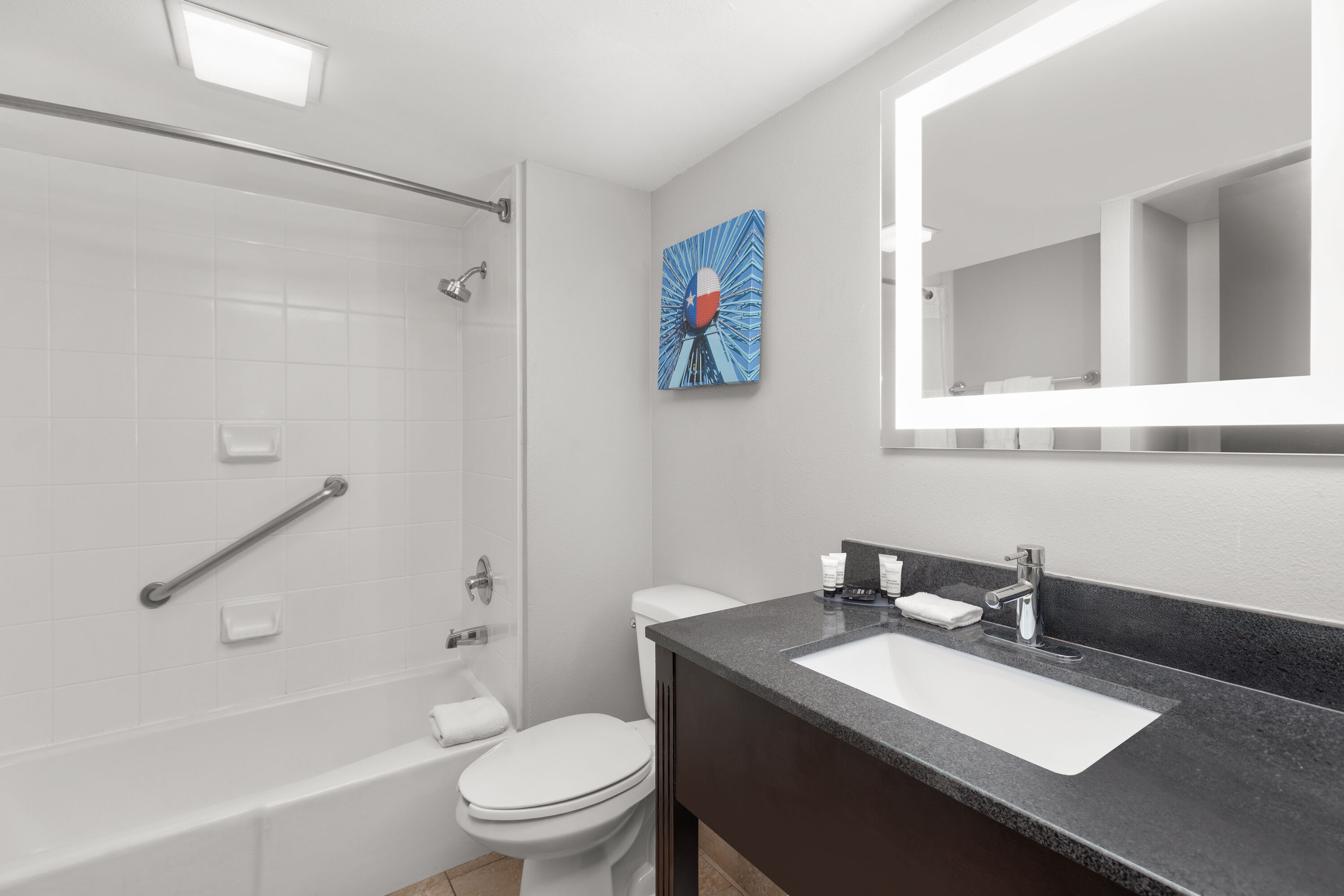 Guest room bath at the La Quinta Inn & Suites by Wyndham Dallas I-35 Walnut Hill Ln in Dallas, Texas