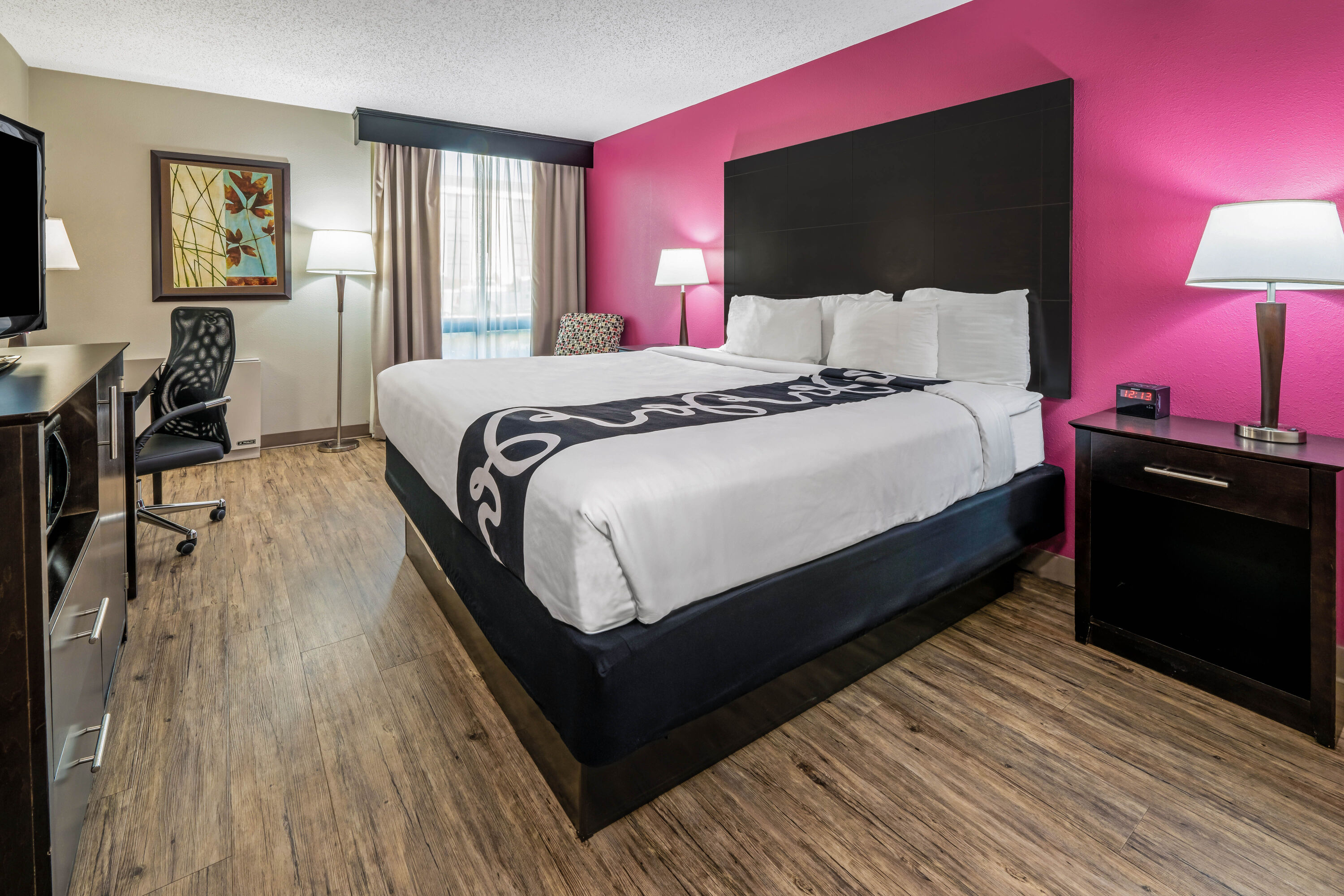 Guest room at the La Quinta Inn & Suites by Wyndham Dallas I-35 Walnut Hill Ln in Dallas, Texas