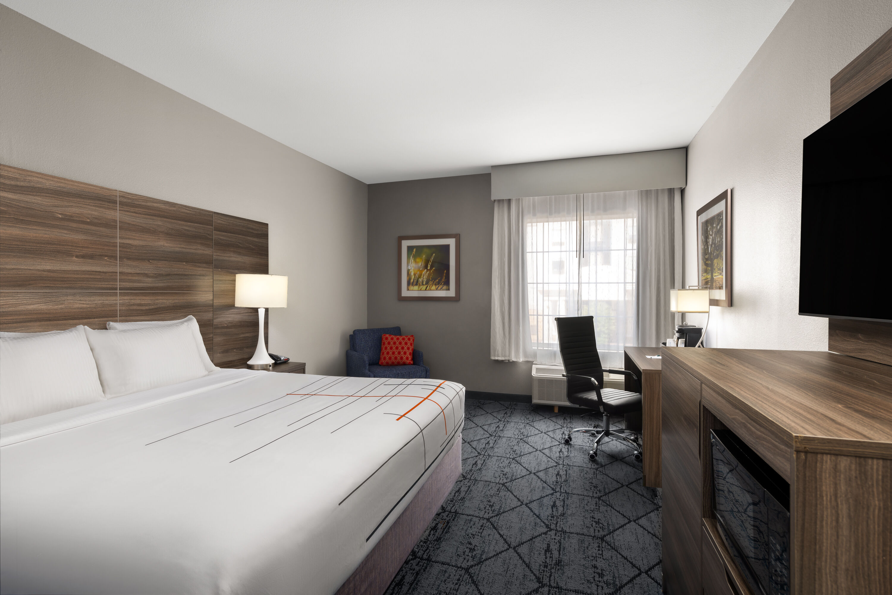 Guest room at the La Quinta Inn & Suites by Wyndham Denton - University Drive in Denton, Texas