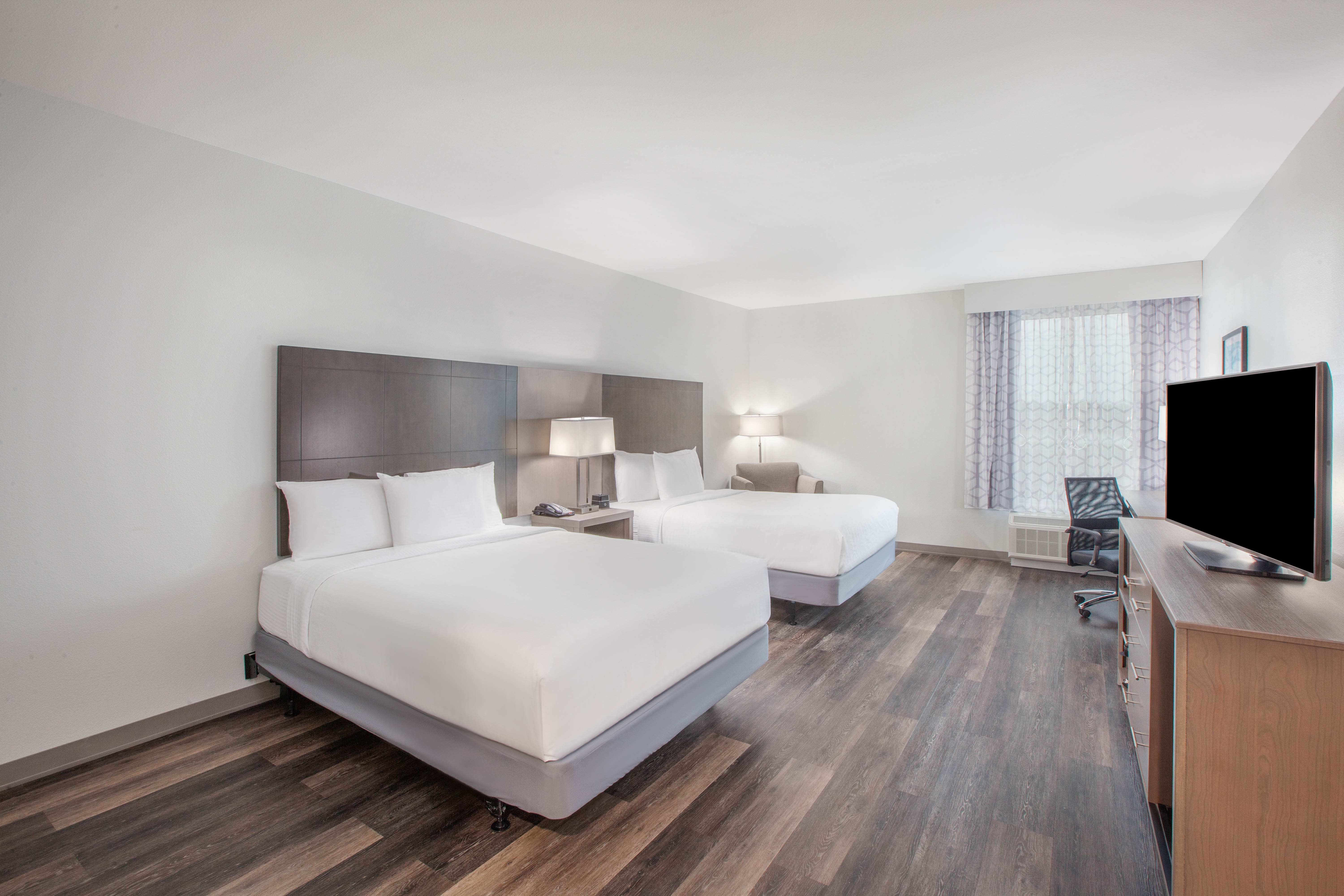 Guest room at the La Quinta Inn & Suites by Wyndham Dallas Duncanville in Duncanville, Texas