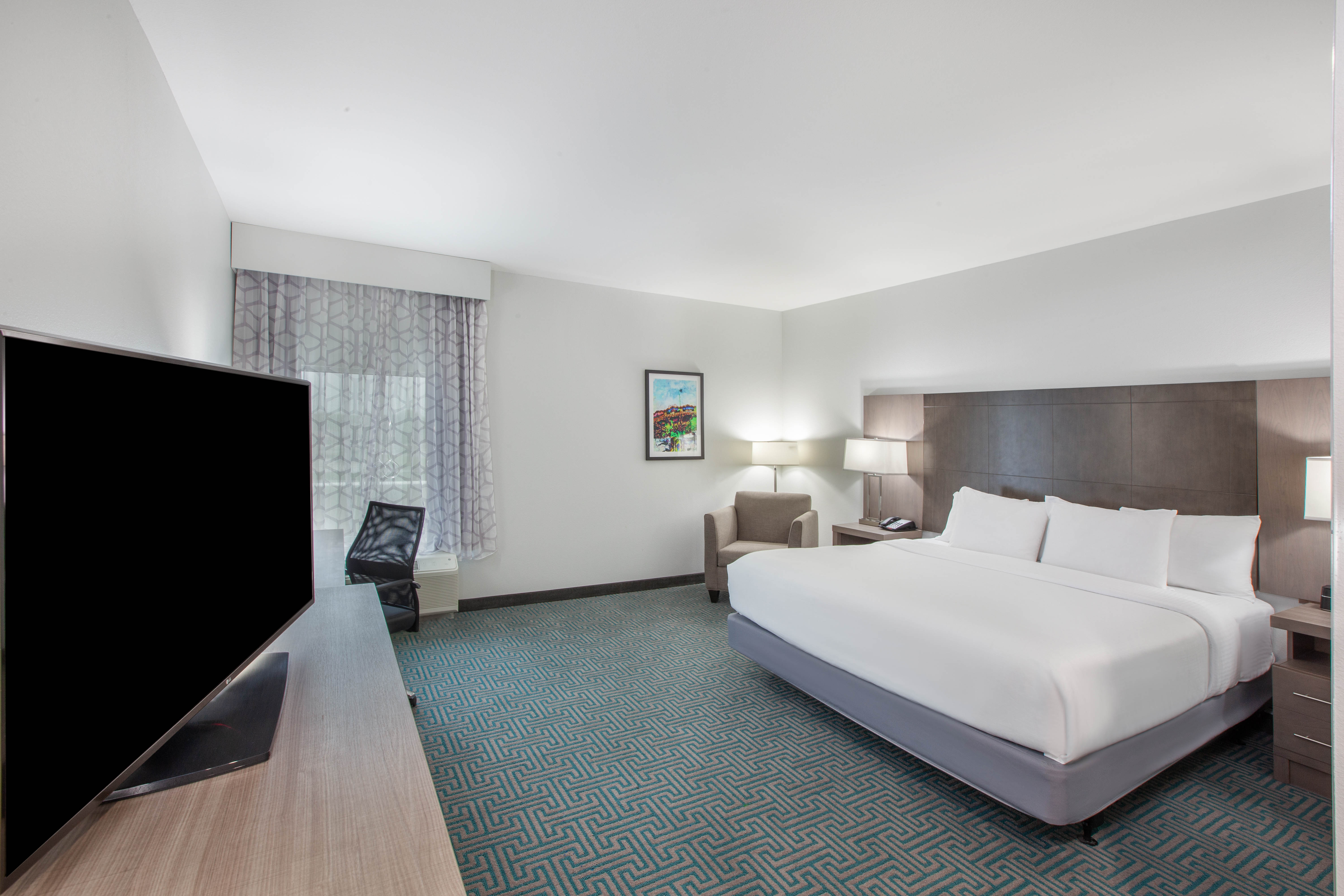 Guest room at the La Quinta Inn & Suites by Wyndham Dallas Duncanville in Duncanville, Texas