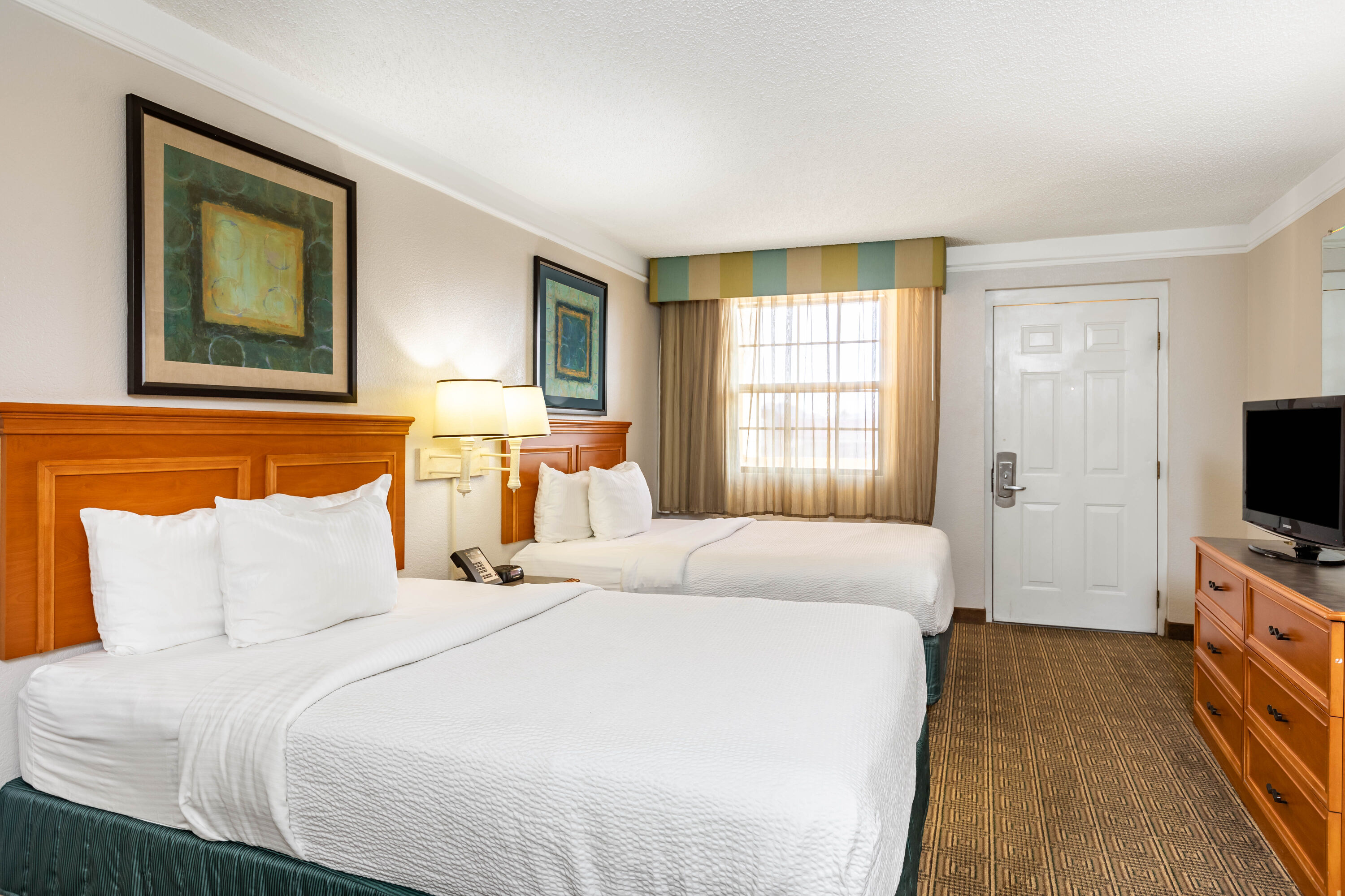Guest room at the La Quinta Inn by Wyndham El Paso West in El Paso, Texas