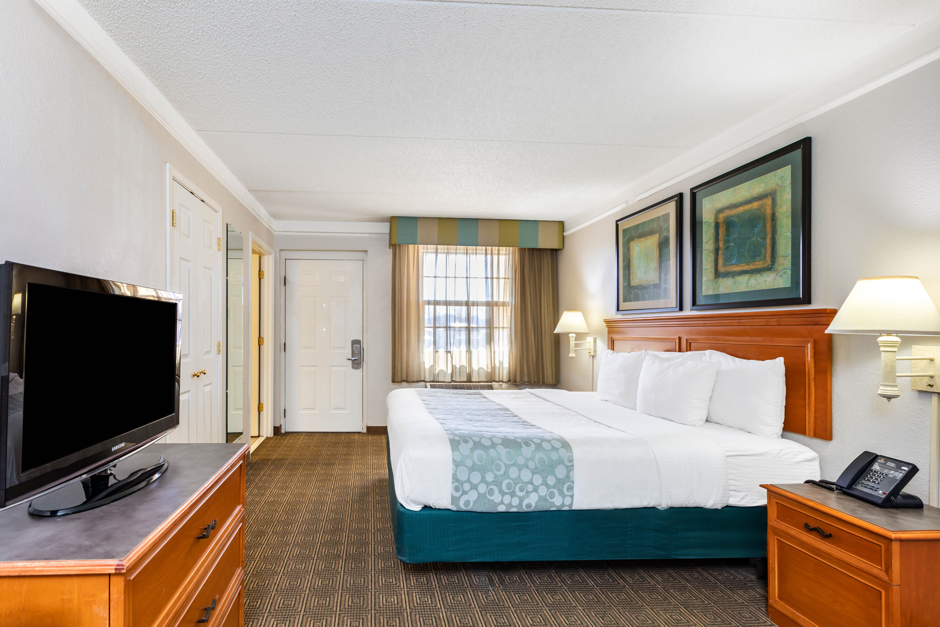 Guest room at the La Quinta Inn by Wyndham El Paso West in El Paso, Texas