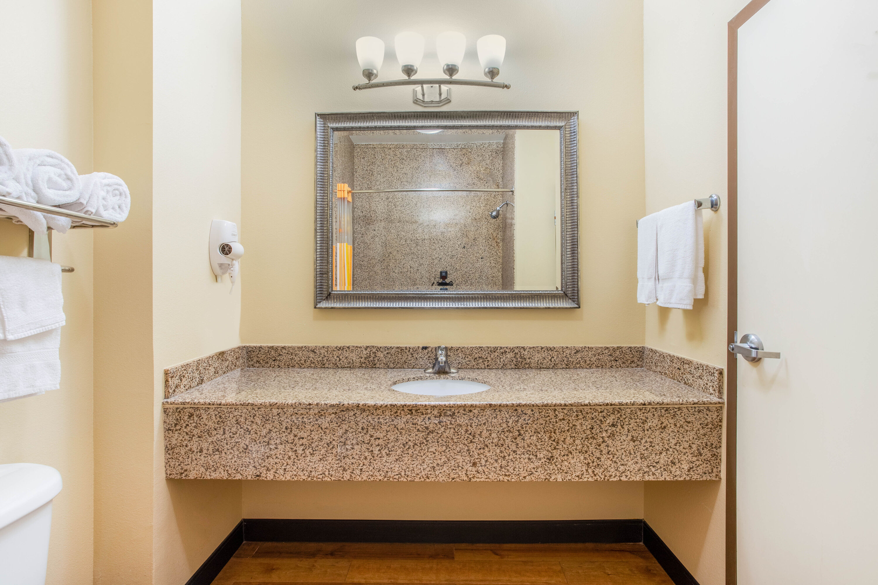 Guest room bath at the La Quinta Inn & Suites by Wyndham Ennis in Ennis, Texas