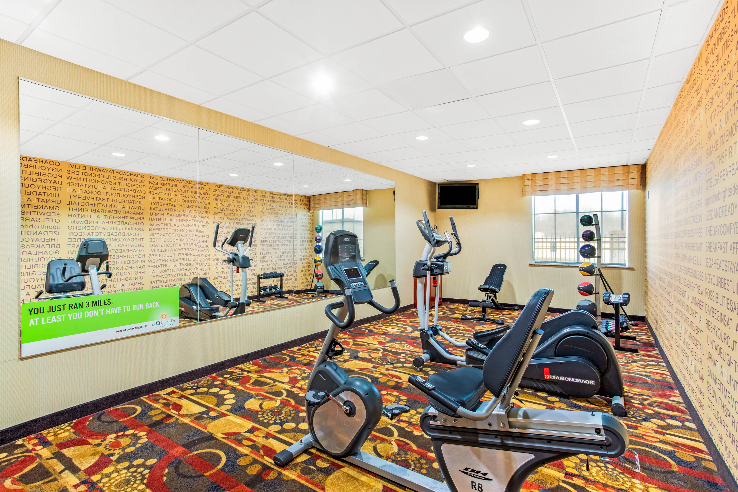 Fitness room at La Quinta Inn & Suites by Wyndham Ennis in Ennis, Texas