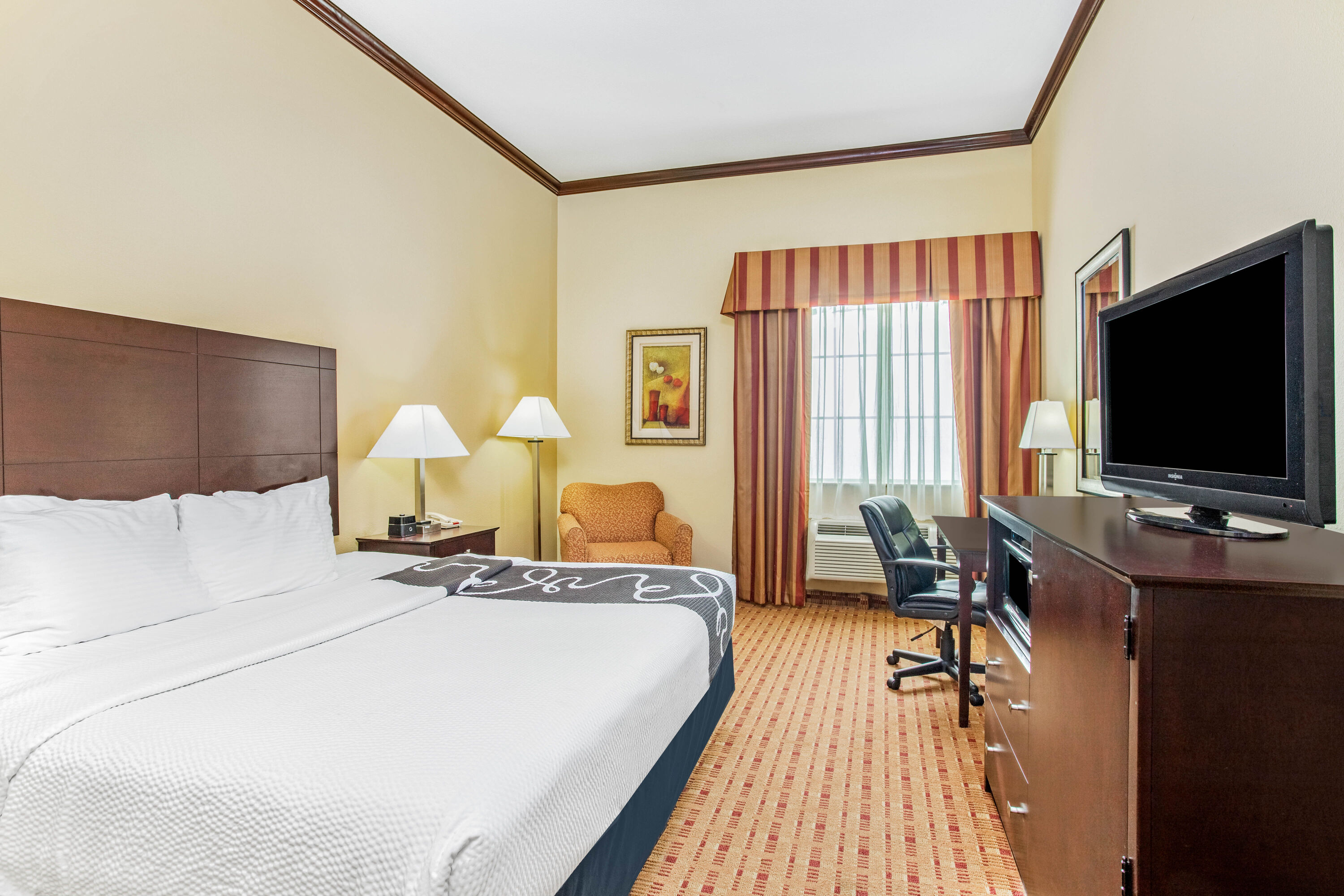 Guest room at the La Quinta Inn & Suites by Wyndham Ennis in Ennis, Texas