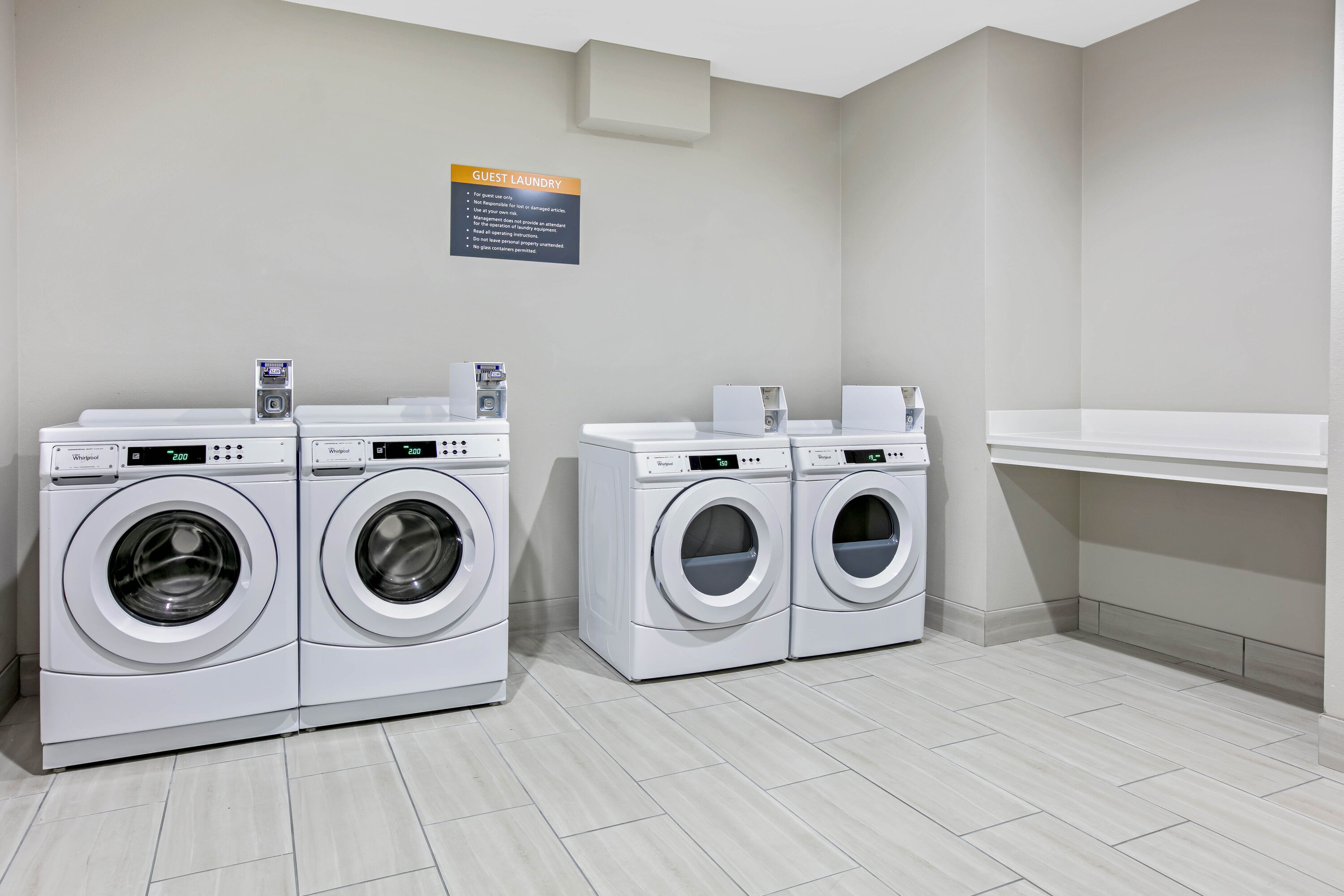 Laundry facilities at La Quinta Inn & Suites by Wyndham DFW West-Glade Parks in Euless, Texas