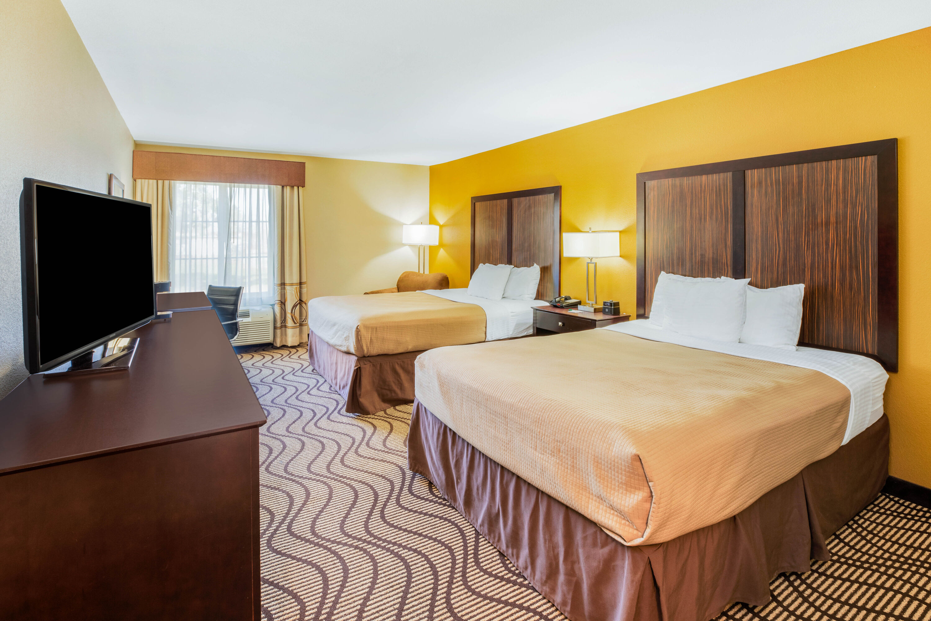 Guest room at the La Quinta Inn & Suites by Wyndham Floresville in Floresville, Texas