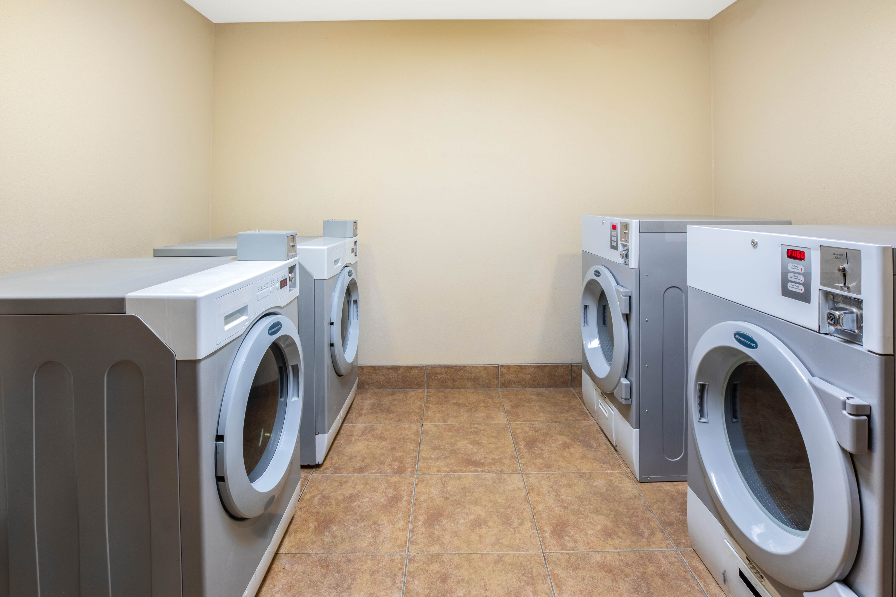 Laundry facilities at La Quinta Inn & Suites by Wyndham Floresville in Floresville, Texas