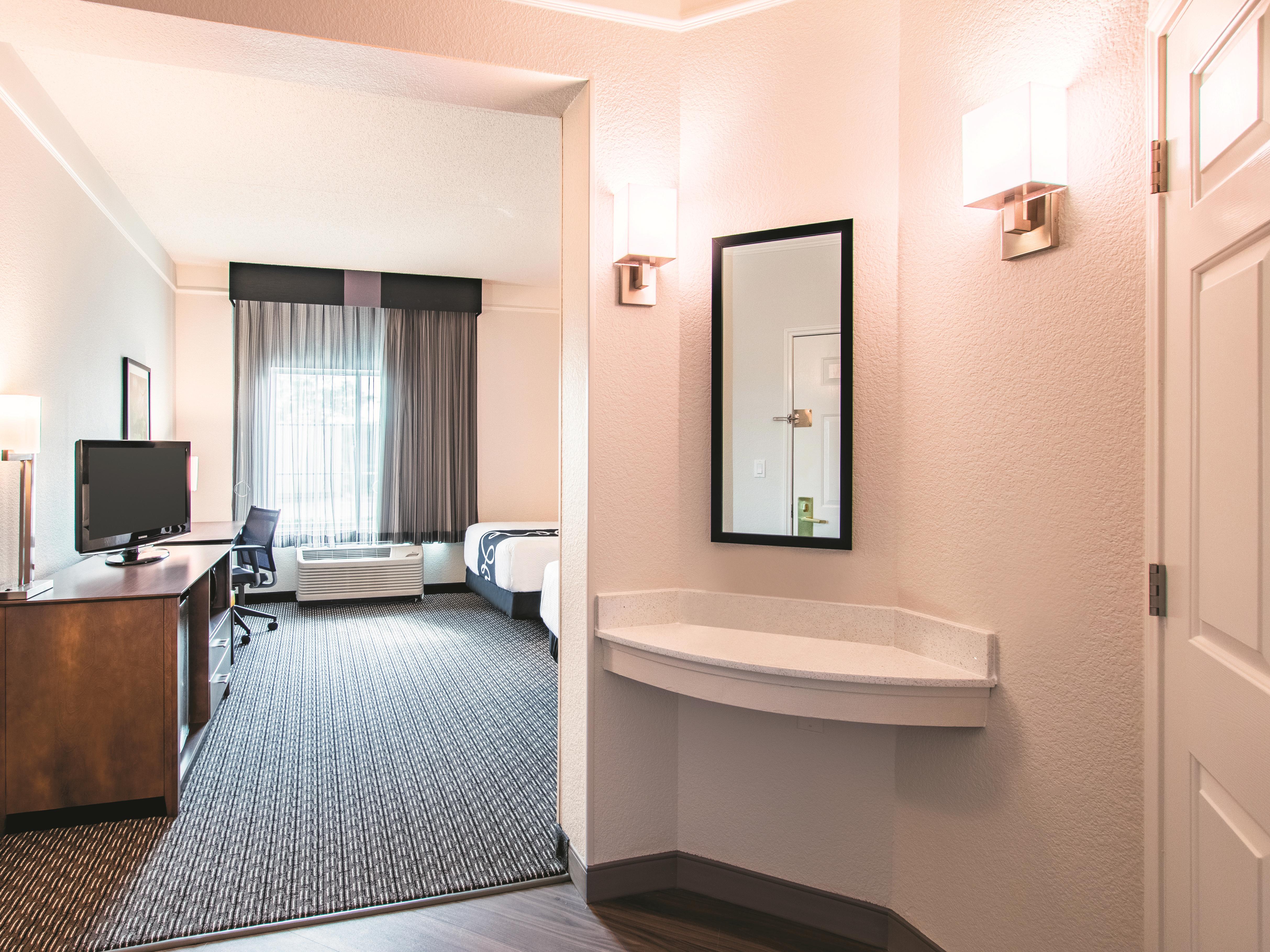 Guest room at the La Quinta Inn & Suites by Wyndham Fort Worth City View in Fort Worth, Texas