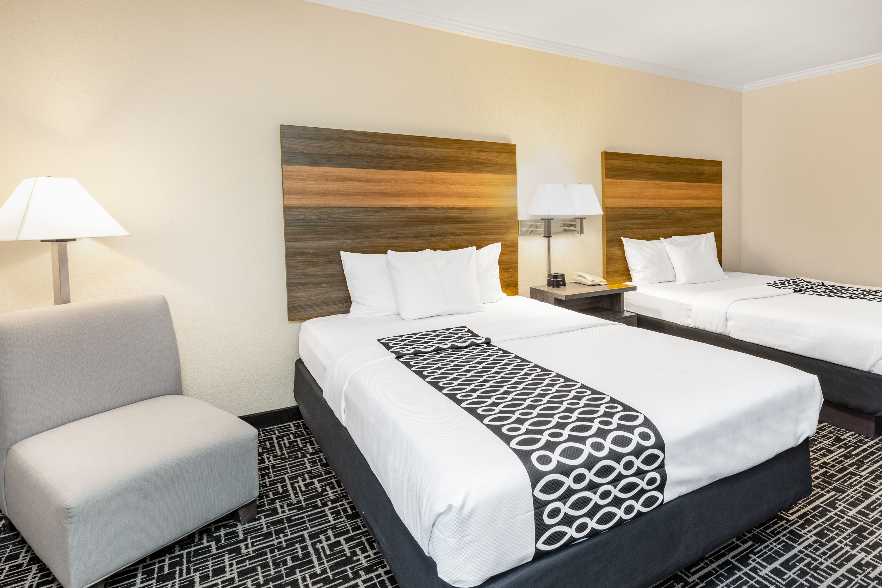 Guest room at the La Quinta Inn & Suites by Wyndham Garland Harbor Point in Garland, Texas