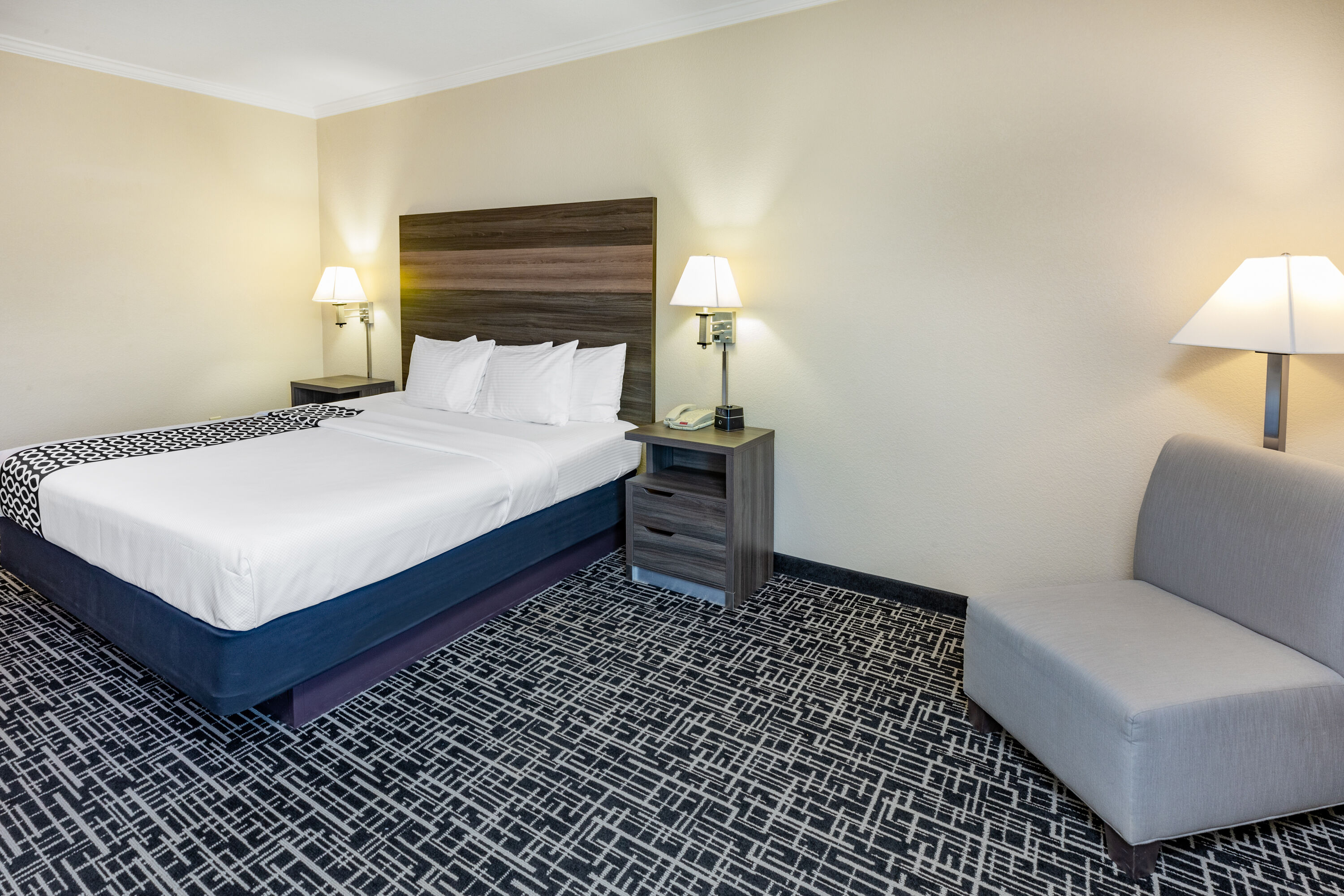 Guest room at the La Quinta Inn & Suites by Wyndham Garland Harbor Point in Garland, Texas