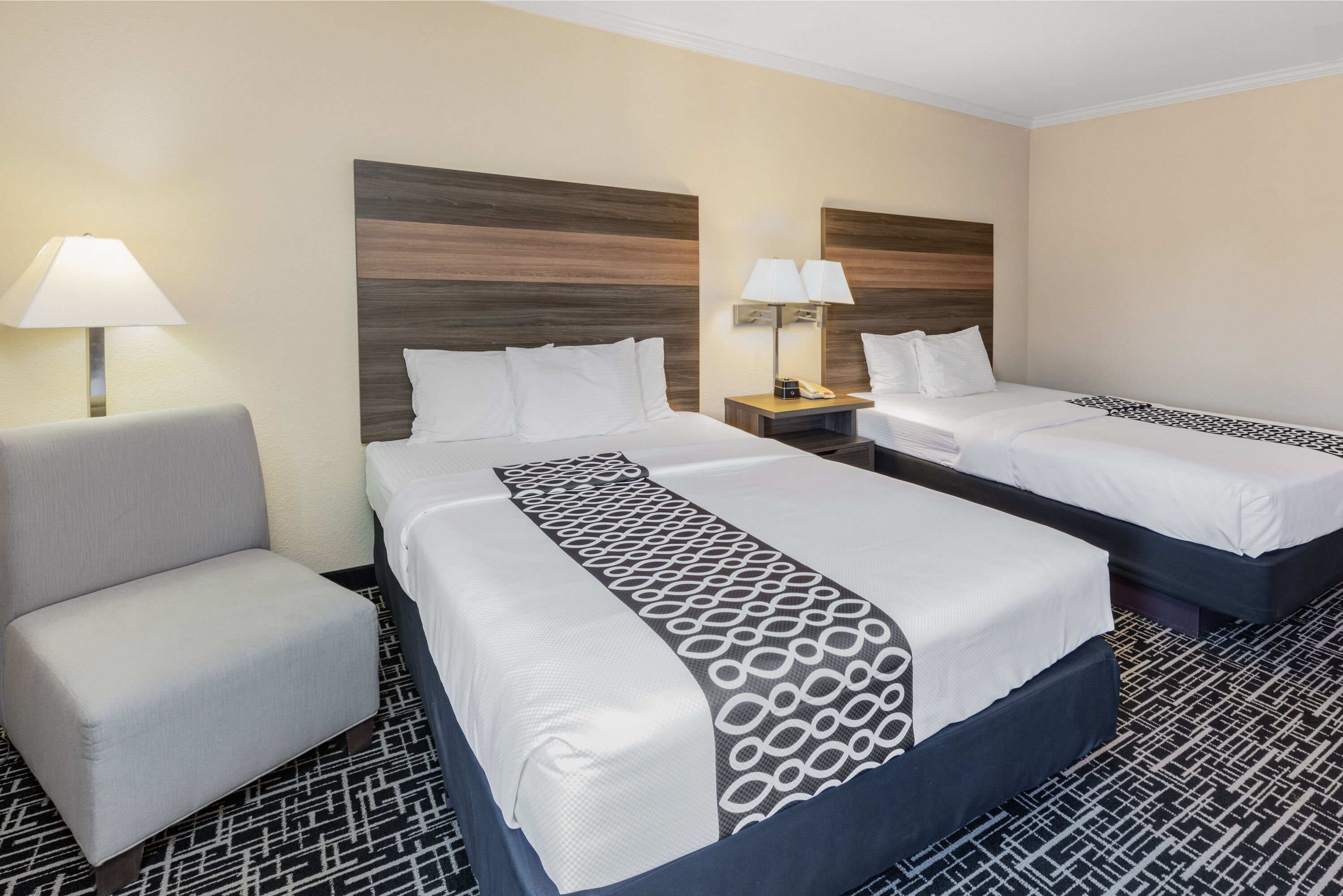 Guest room at the La Quinta Inn & Suites by Wyndham Garland Harbor Point in Garland, Texas