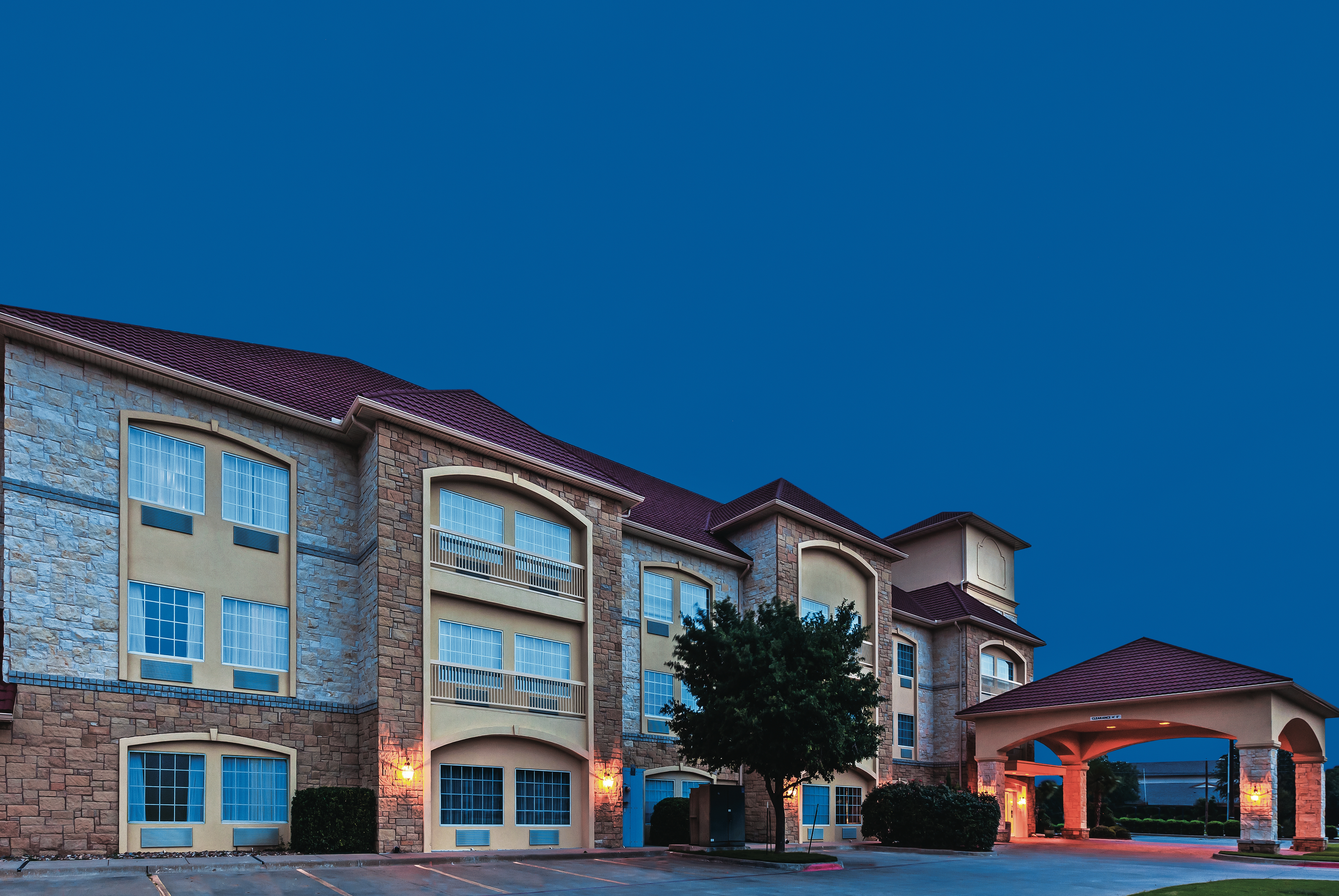 Exterior of La Quinta Inn & Suites by Wyndham Granbury hotel in Granbury, Texas