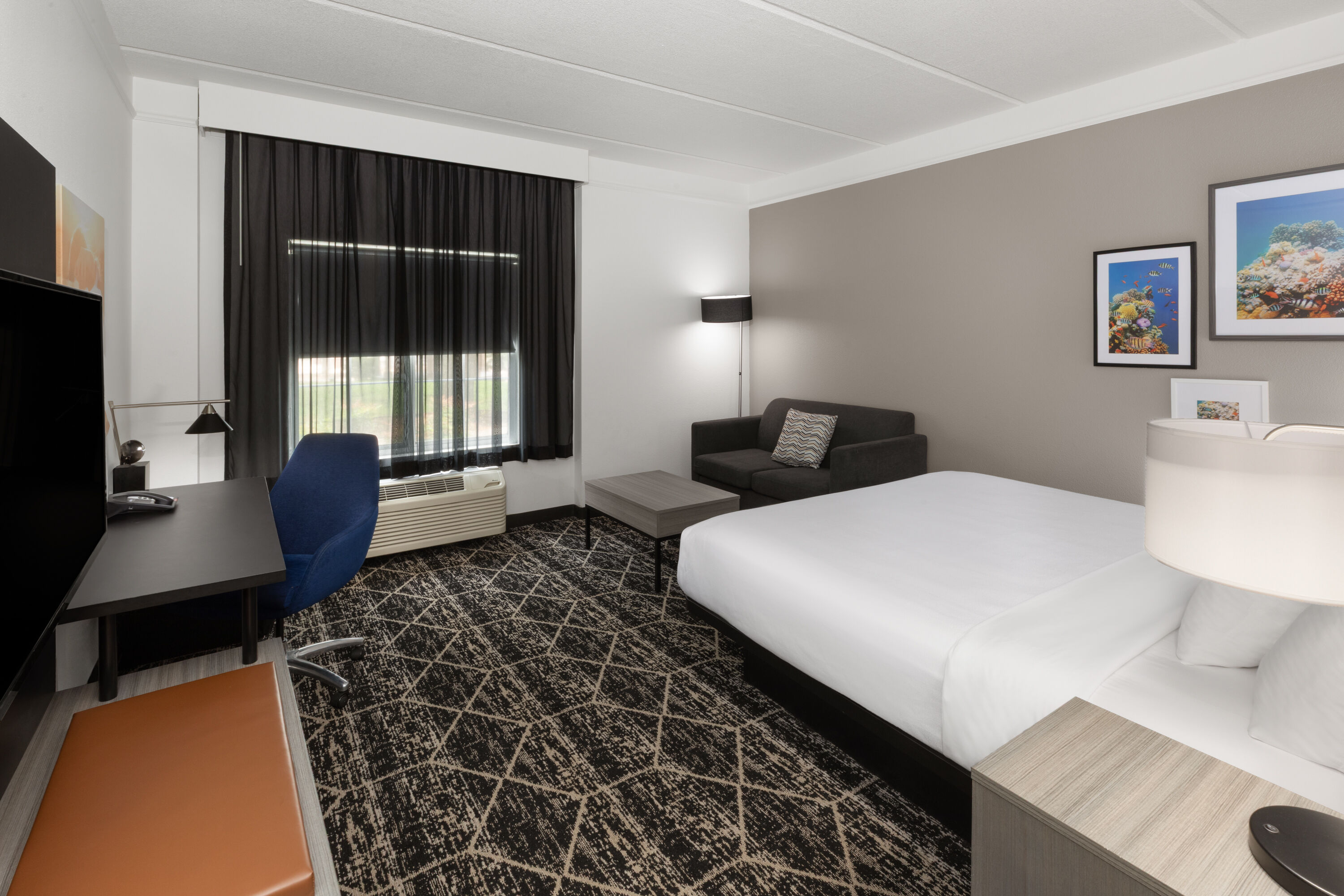 Guest room at the La Quinta Inn & Suites by Wyndham Houston Bush IAH South in Houston, Texas