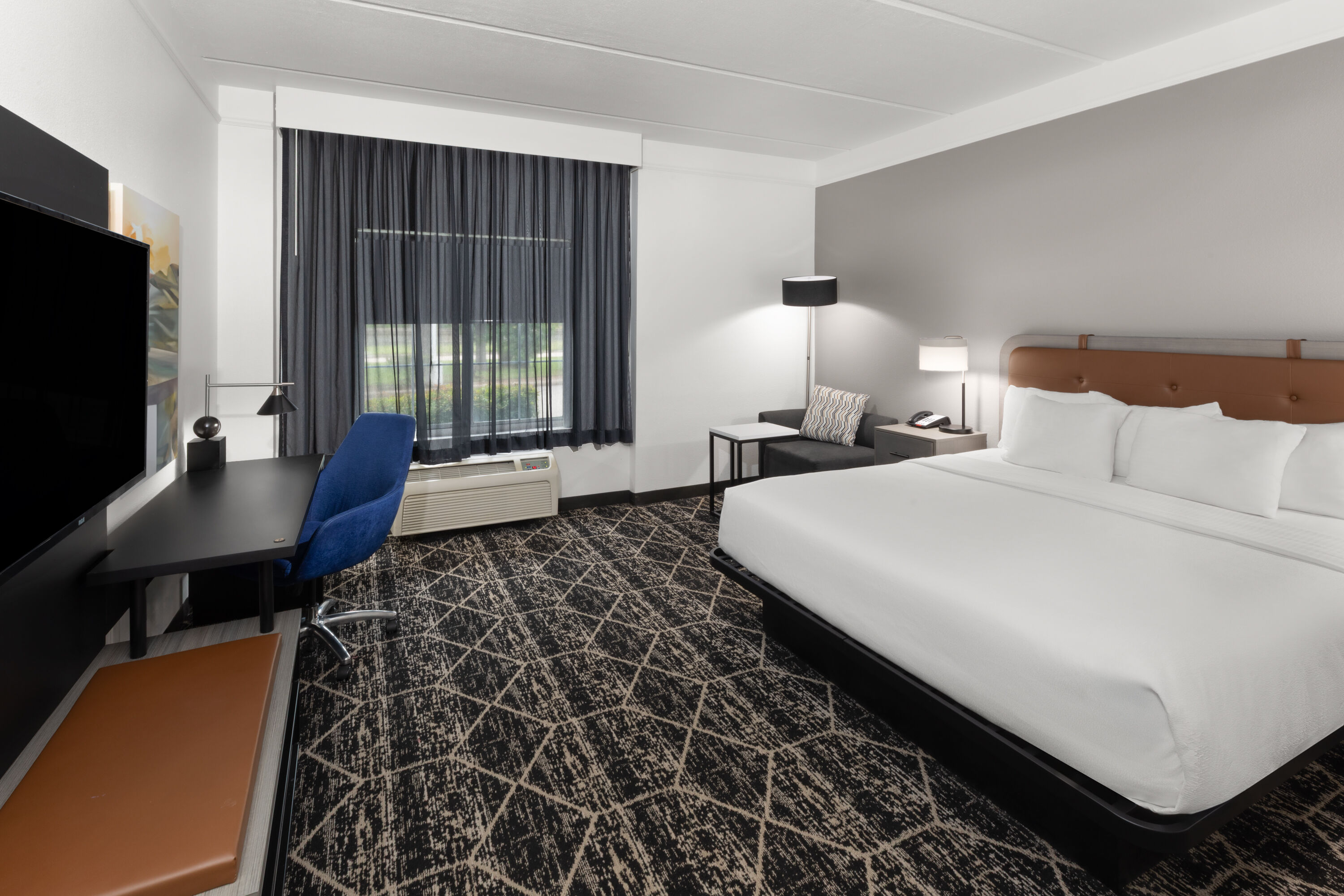 Guest room at the La Quinta Inn & Suites by Wyndham Houston Bush IAH South in Houston, Texas