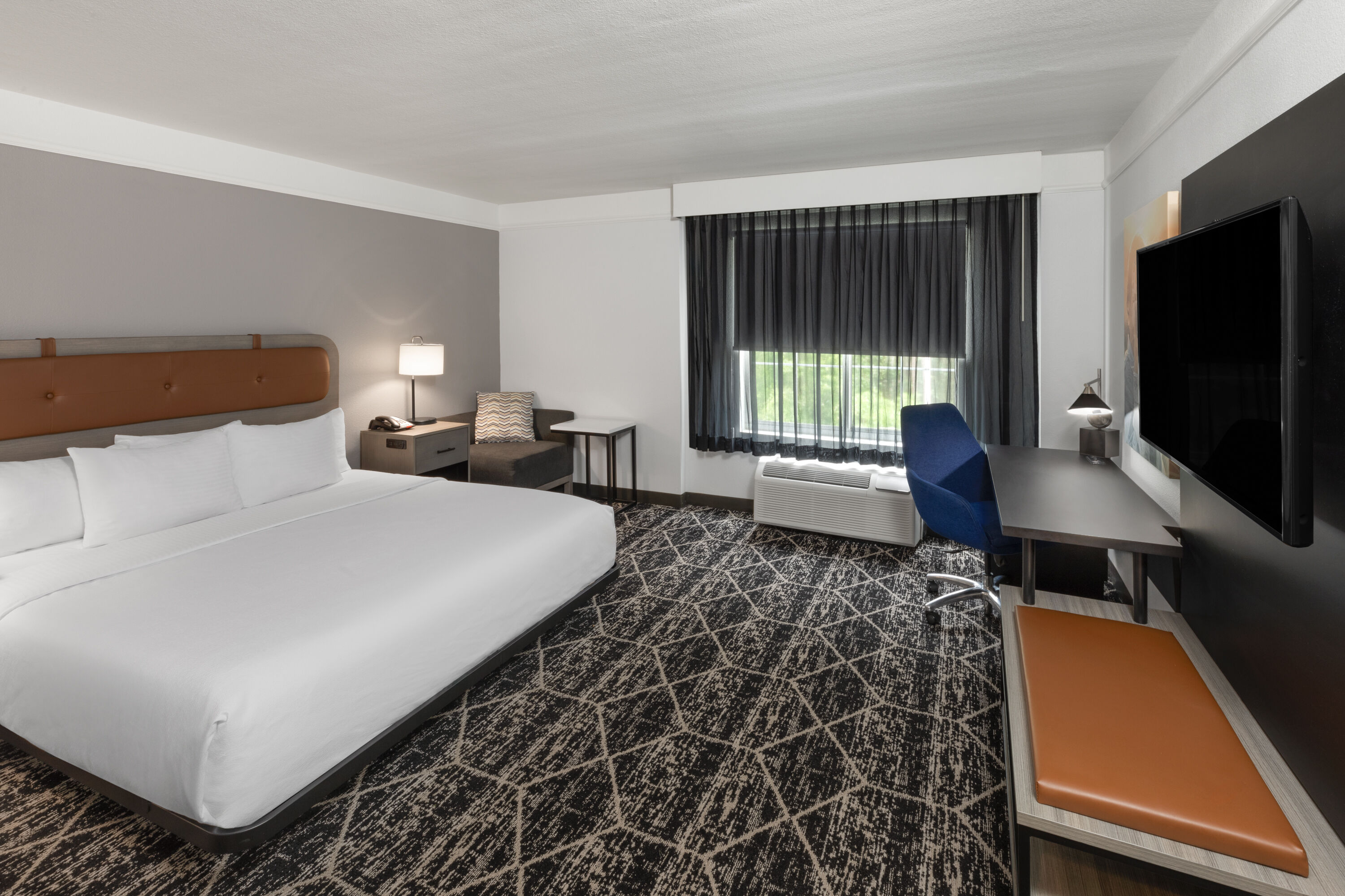 Guest room at the La Quinta Inn & Suites by Wyndham Houston Bush IAH South in Houston, Texas