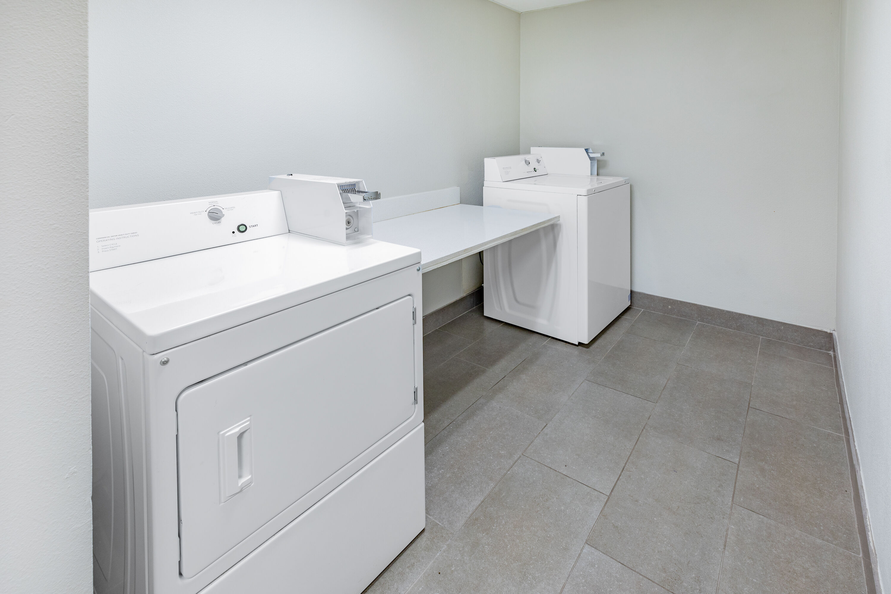 Laundry facilities at La Quinta Inn & Suites by Wyndham Houston Southwest in Houston, Texas