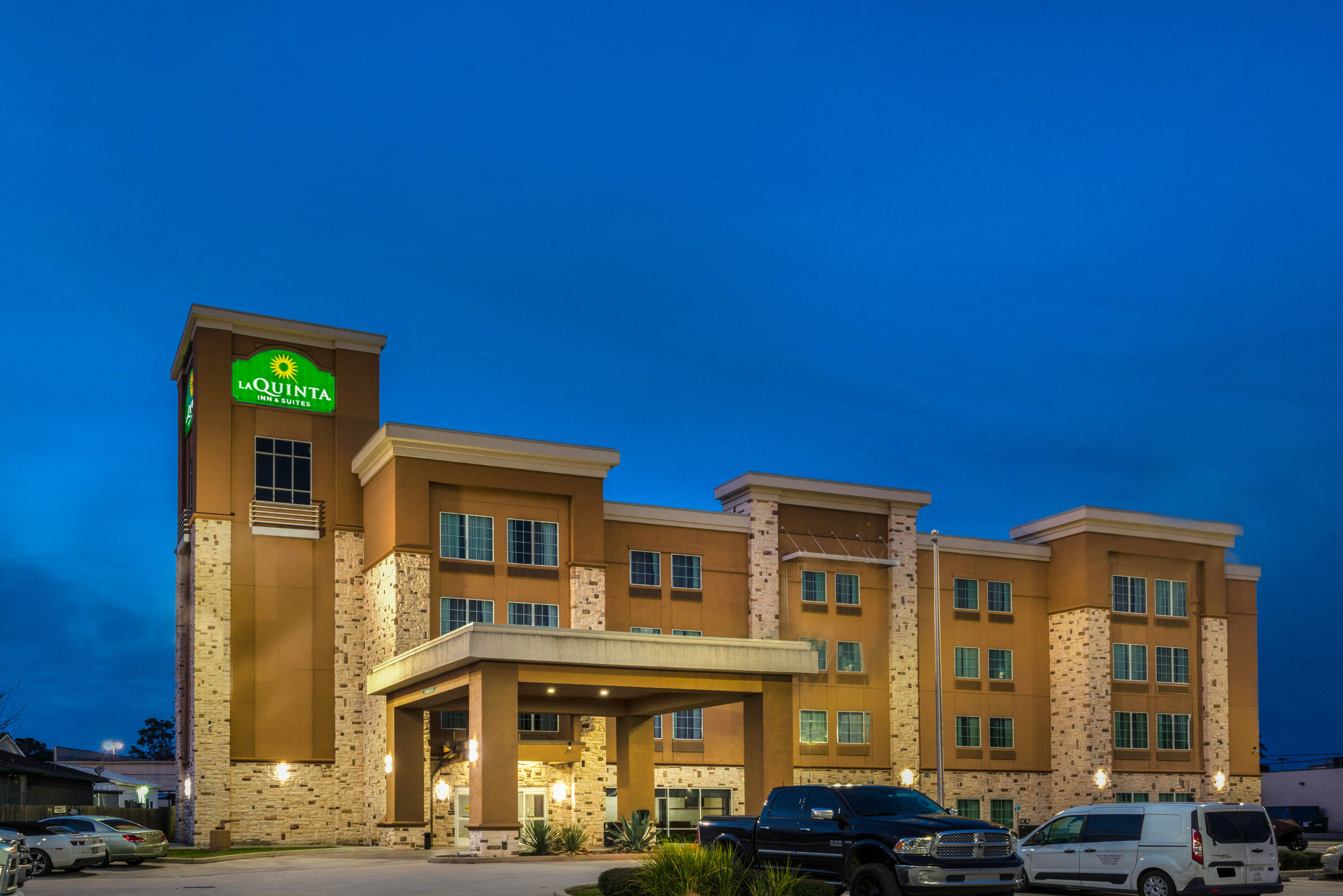 Exterior Night Image of La Quinta Inn & Suites by Wyndham Houston Humble Atascocita hotel in Humble, Texas
