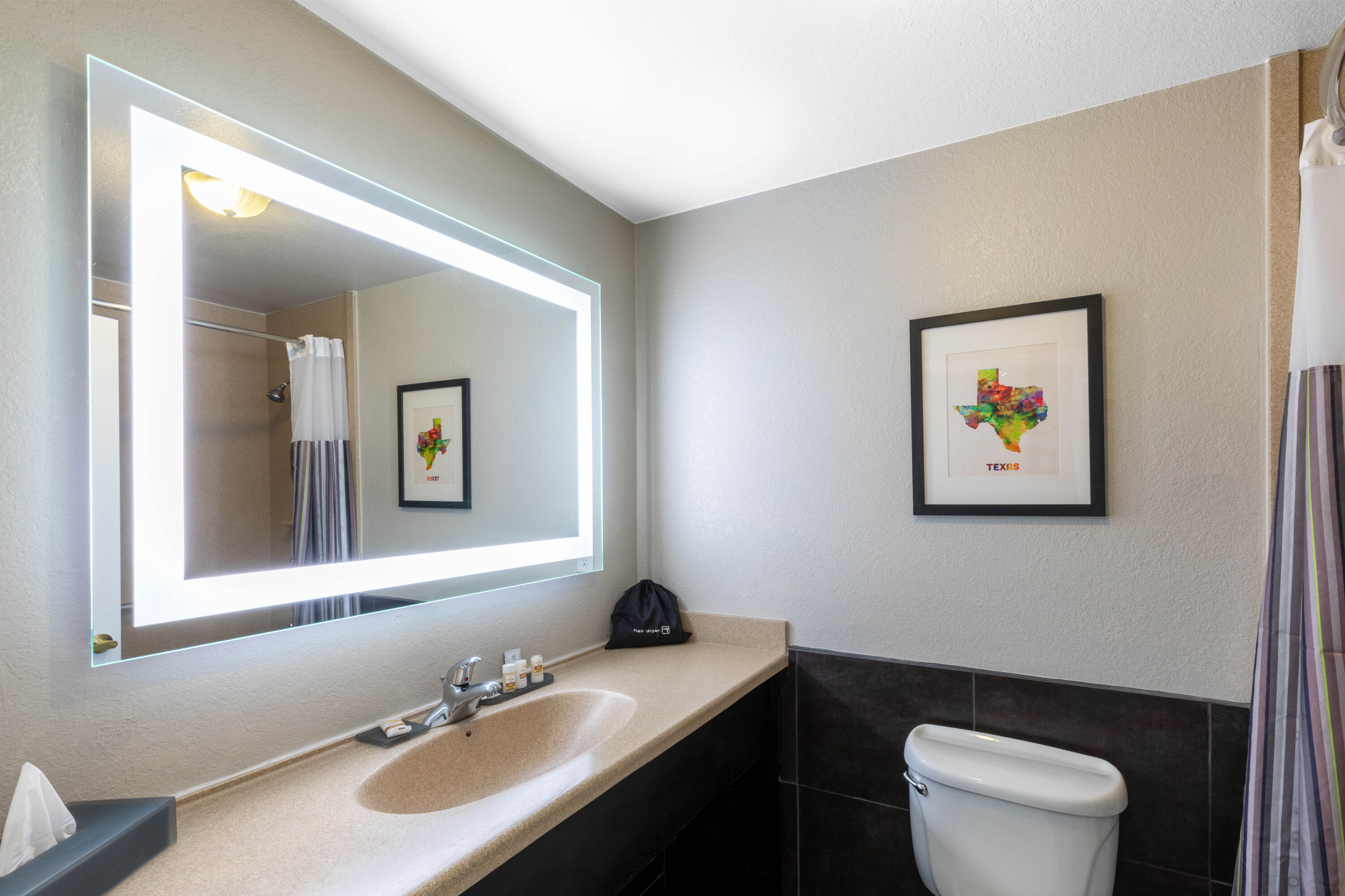 Guest room bath at the La Quinta Inn & Suites by Wyndham Laredo Airport in Laredo, Texas
