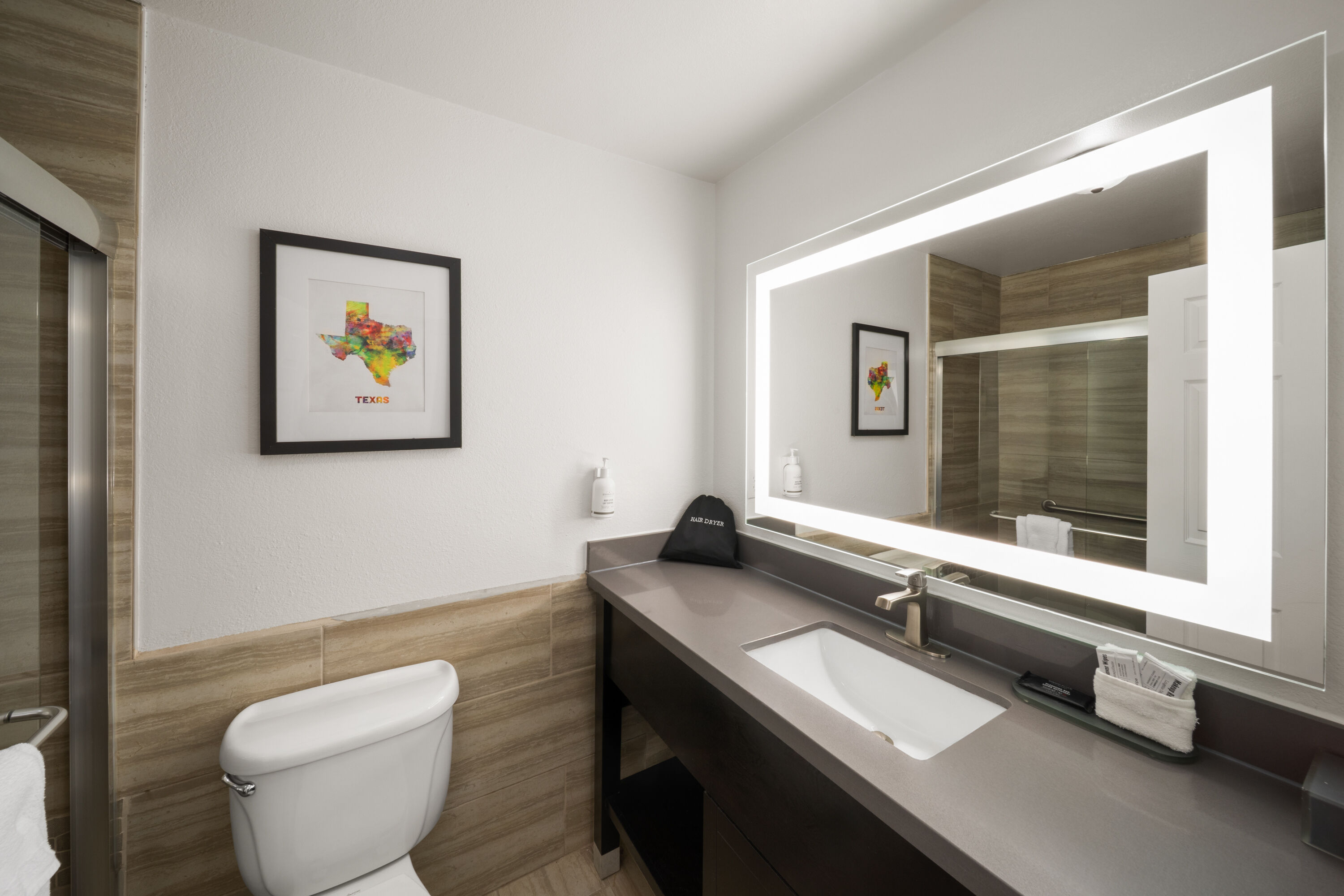 Guest room bath at the La Quinta Inn & Suites by Wyndham Laredo Airport in Laredo, Texas