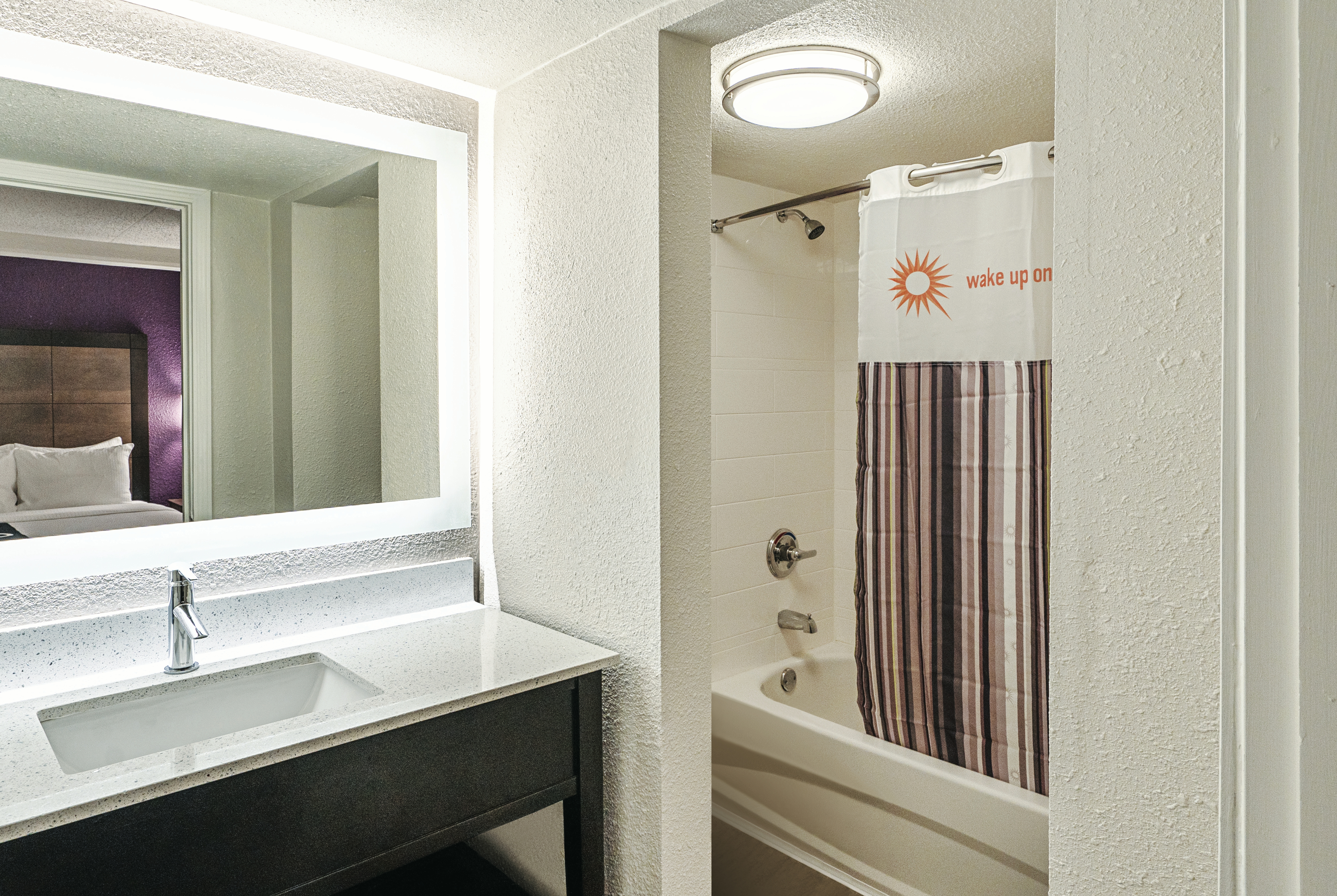 Guest room bath at the La Quinta Inn & Suites by Wyndham Lubbock West Medical Centr in Lubbock, Texas