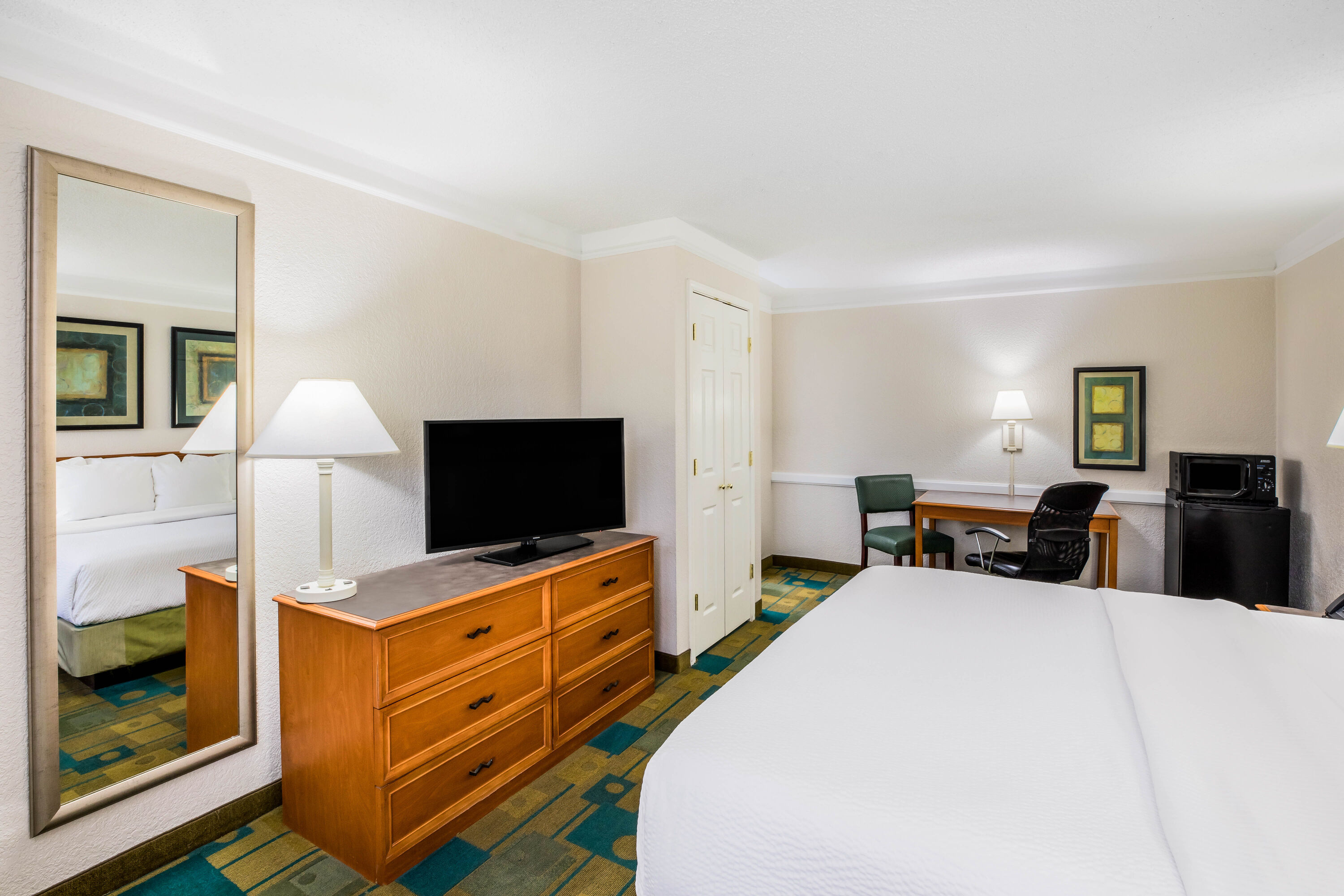 Guest room at the La Quinta Inn by Wyndham Lufkin in Lufkin, Texas