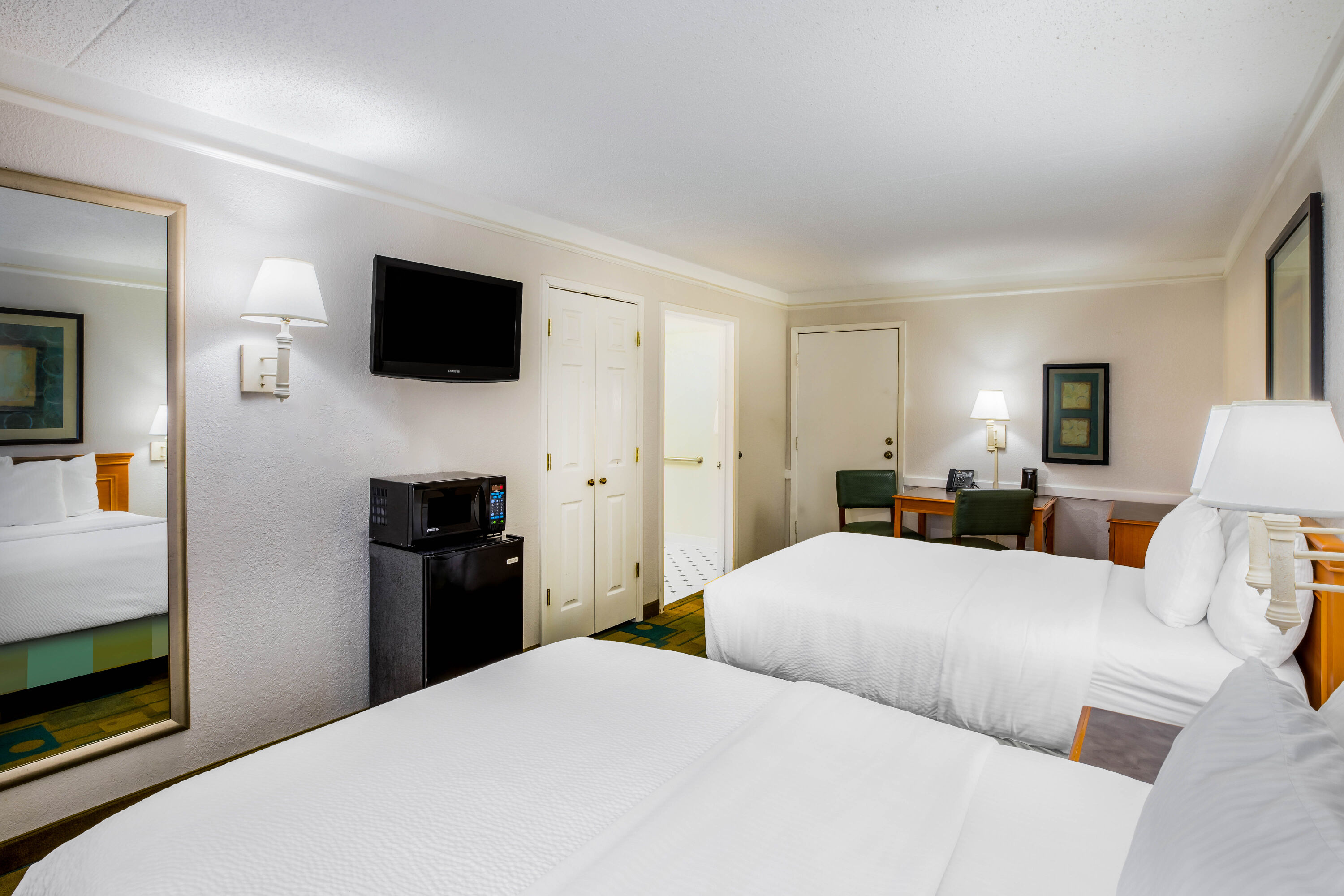Guest room at the La Quinta Inn by Wyndham Lufkin in Lufkin, Texas