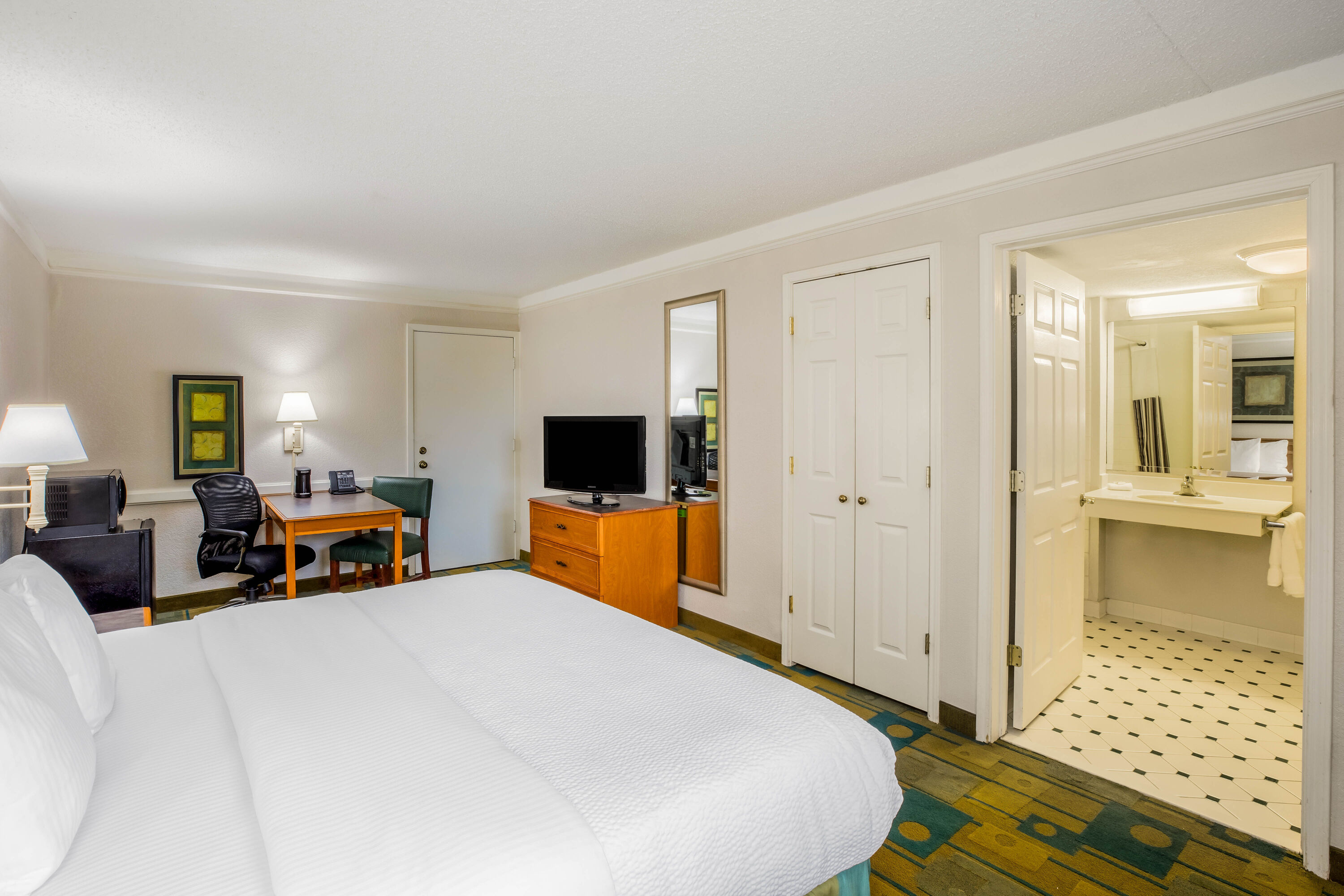 Guest room at the La Quinta Inn by Wyndham Lufkin in Lufkin, Texas