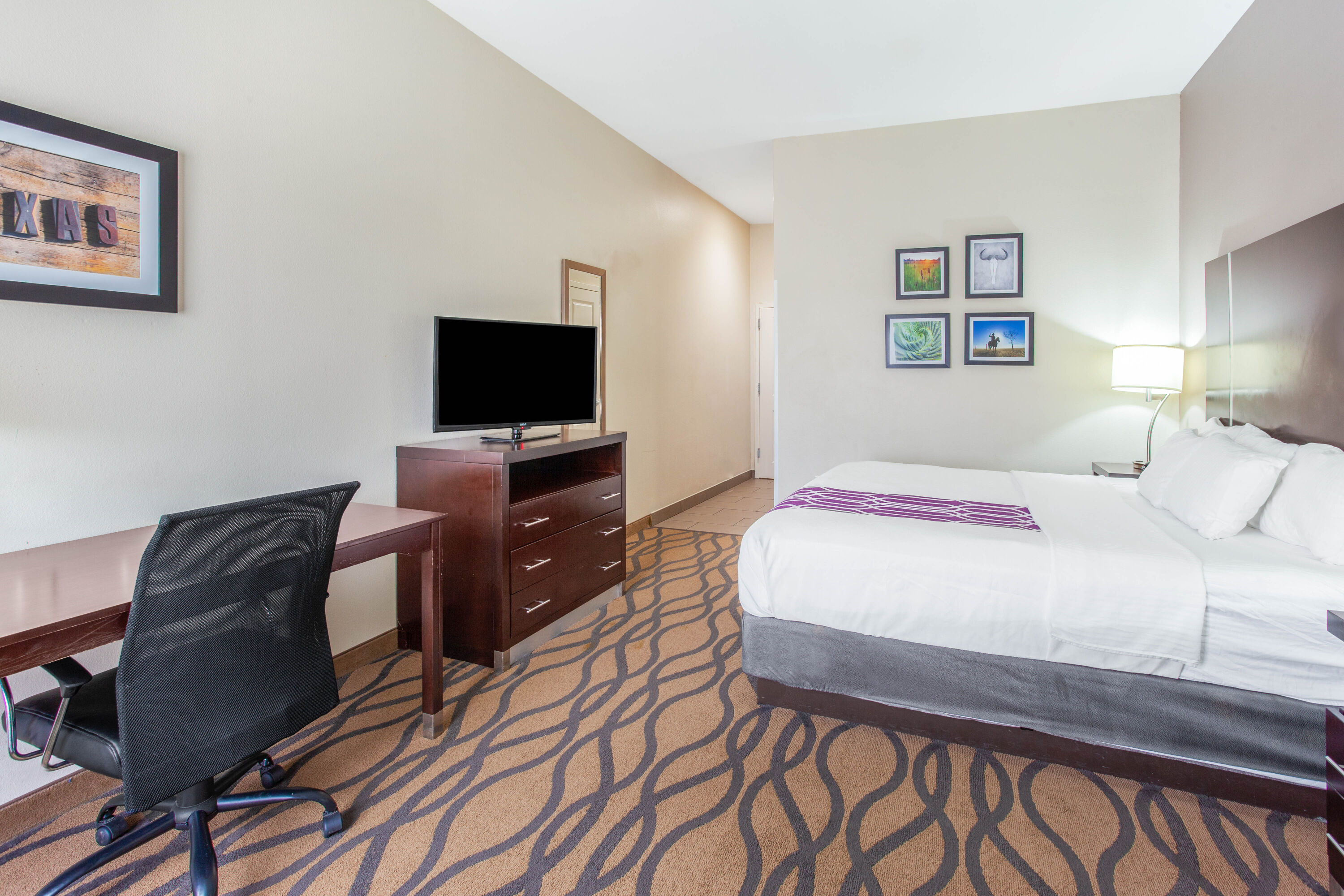 Guest room at the La Quinta Inn & Suites by Wyndham Luling in Luling, Texas