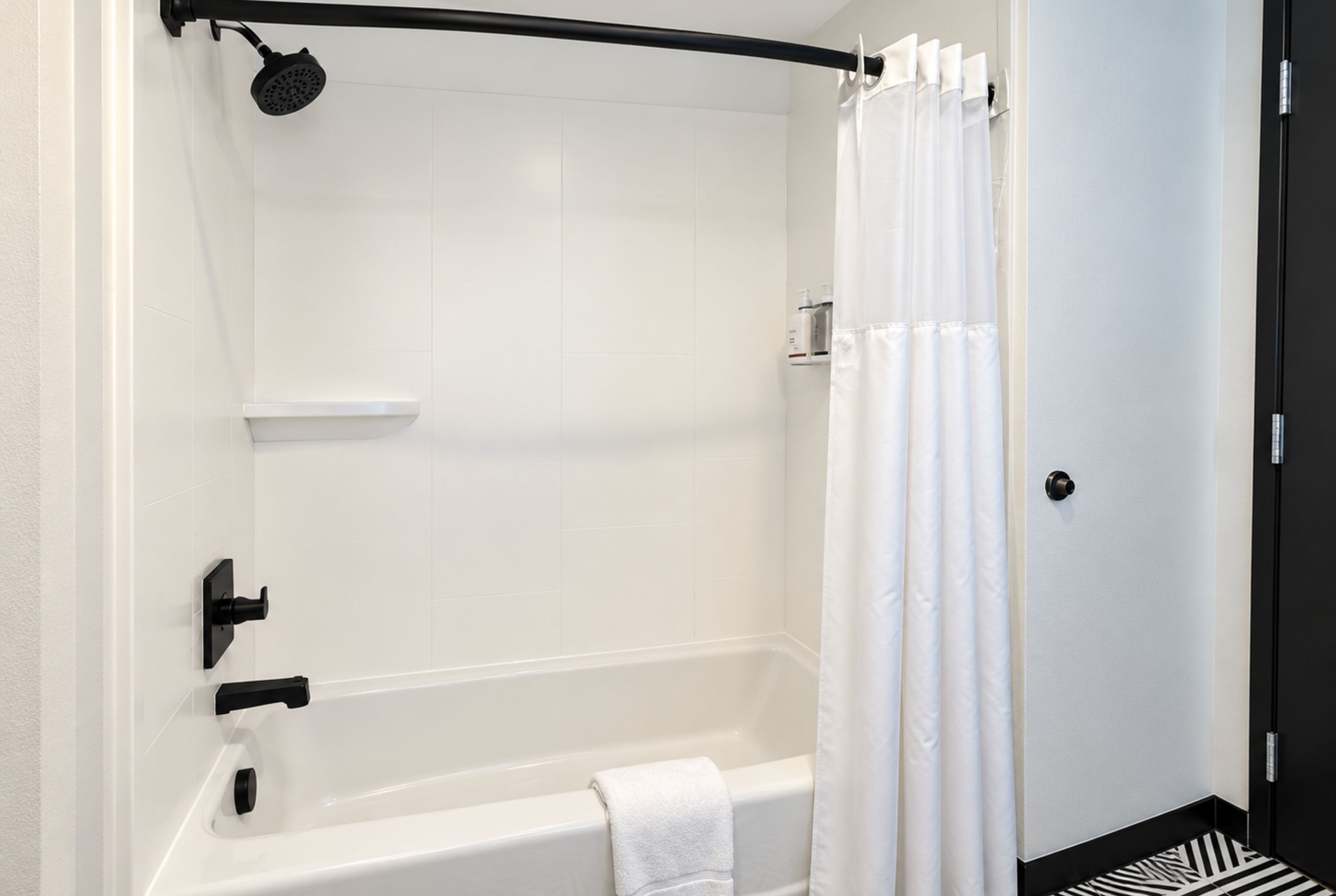 Guest room bath at the La Quinta Inn and Suites by Wyndham Central McKinney in Mckinney, Texas