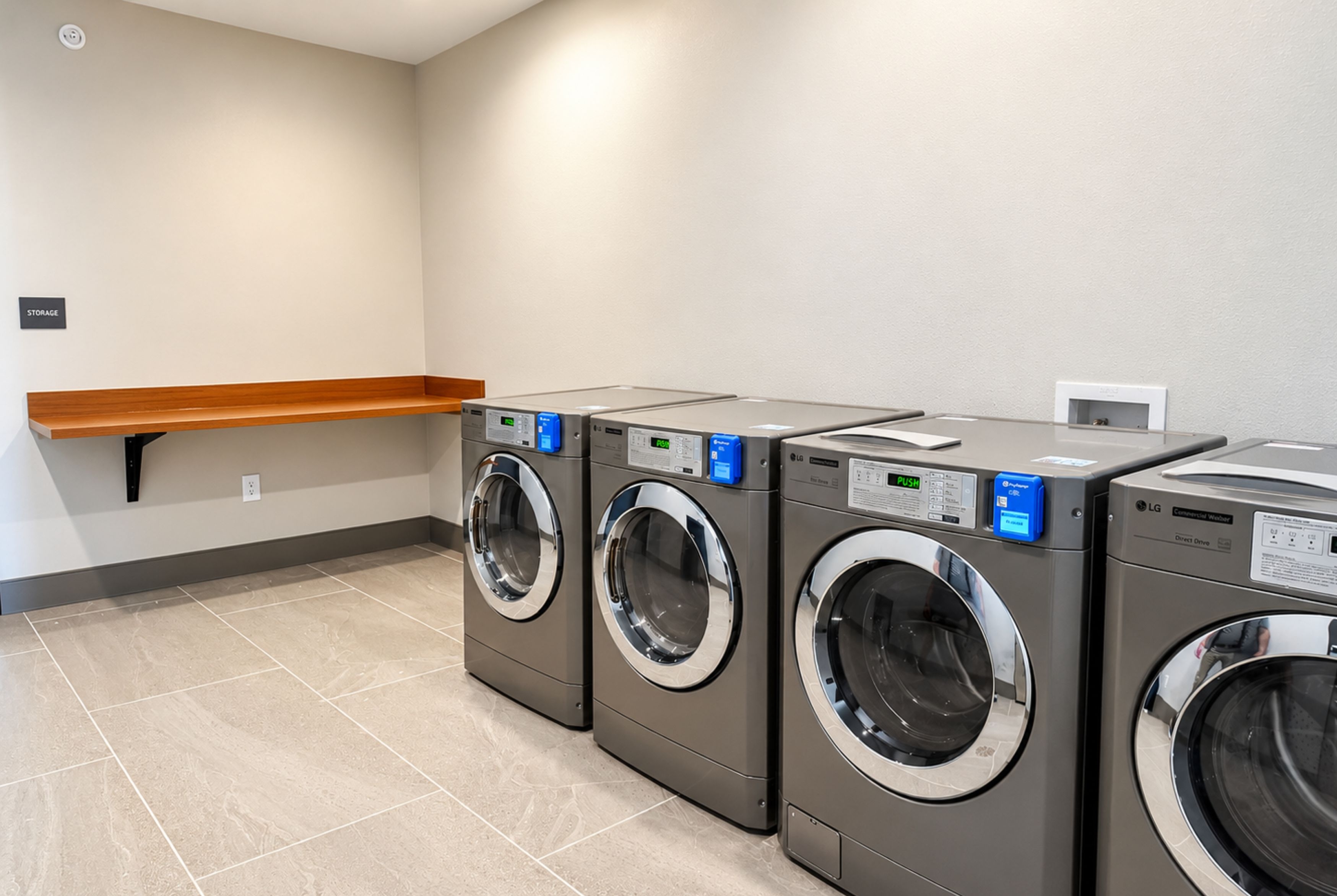 Laundry facilities at La Quinta Inn and Suites by Wyndham Central McKinney in Mckinney, Texas