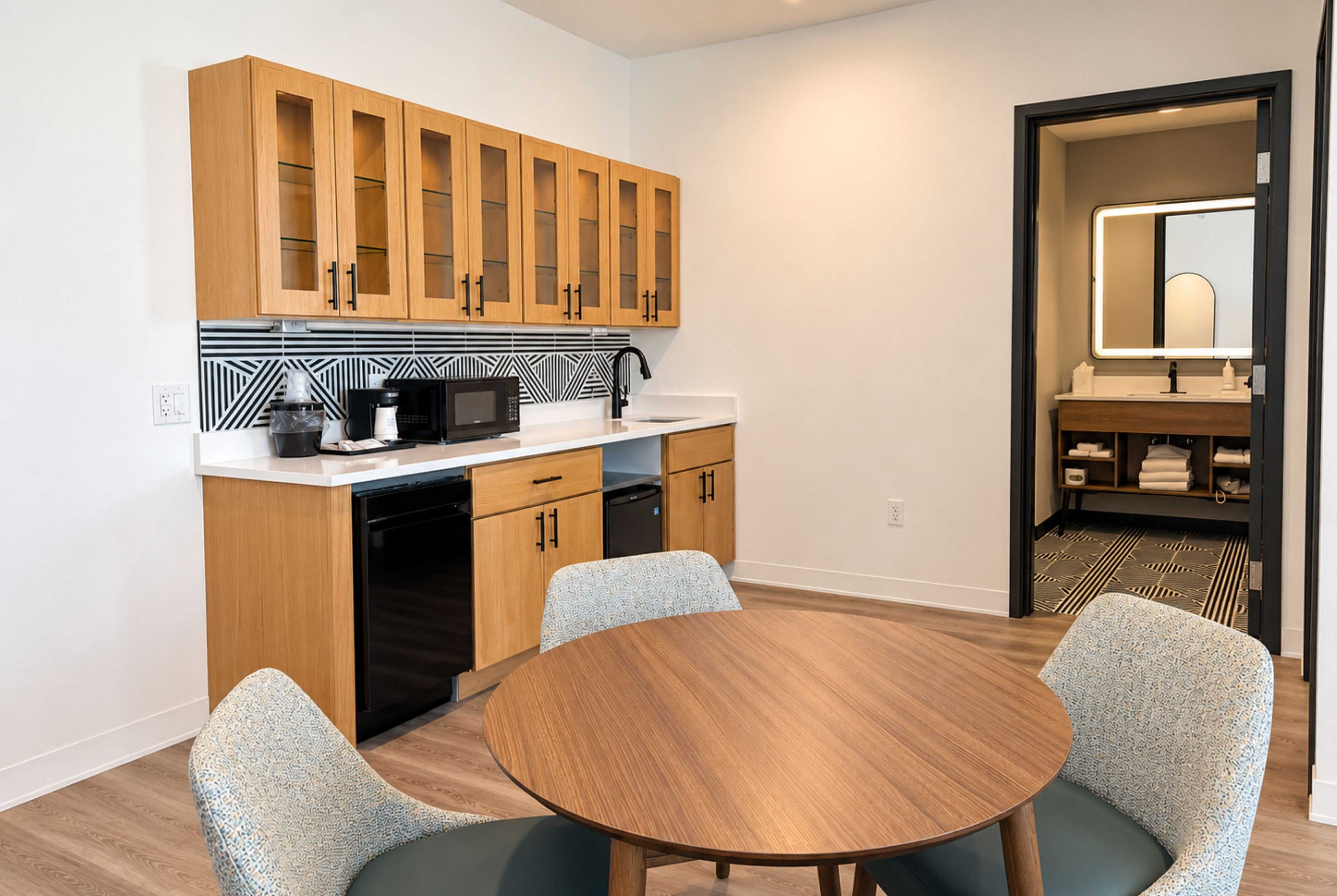 Guest room at the La Quinta Inn and Suites by Wyndham Central McKinney in Mckinney, Texas