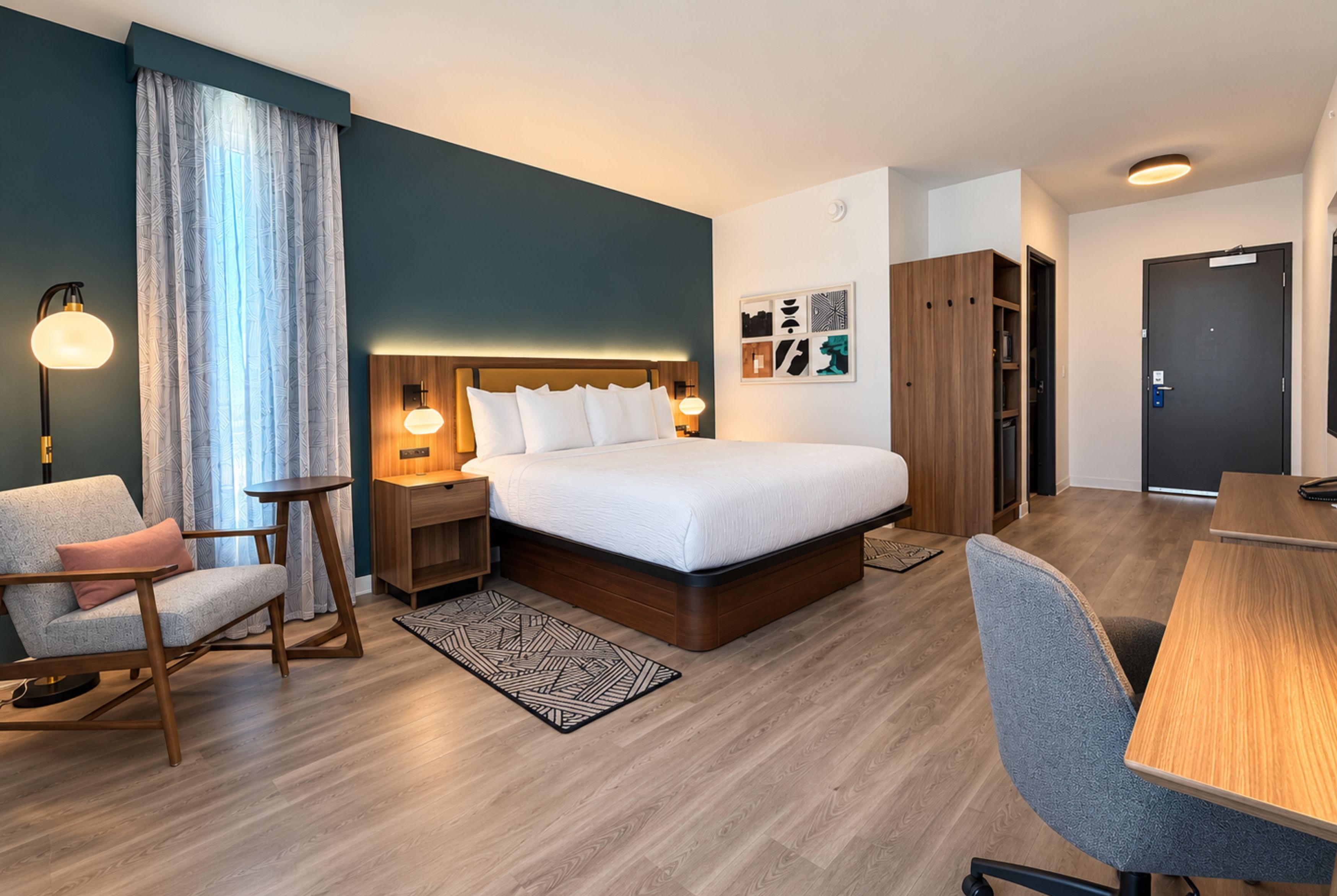 Guest room at the La Quinta Inn and Suites by Wyndham Central McKinney in Mckinney, Texas
