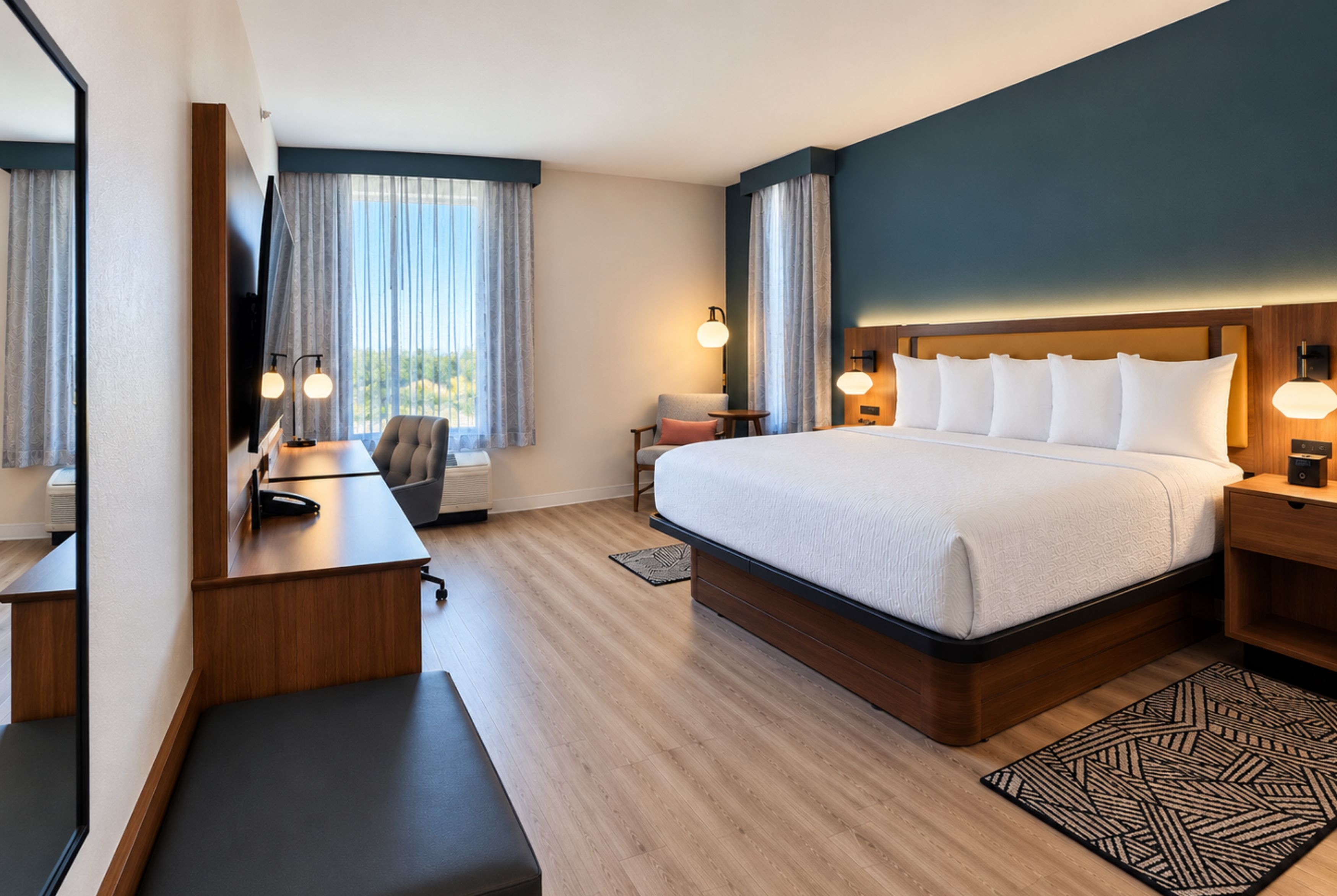 Guest room at the La Quinta Inn and Suites by Wyndham Central McKinney in Mckinney, Texas