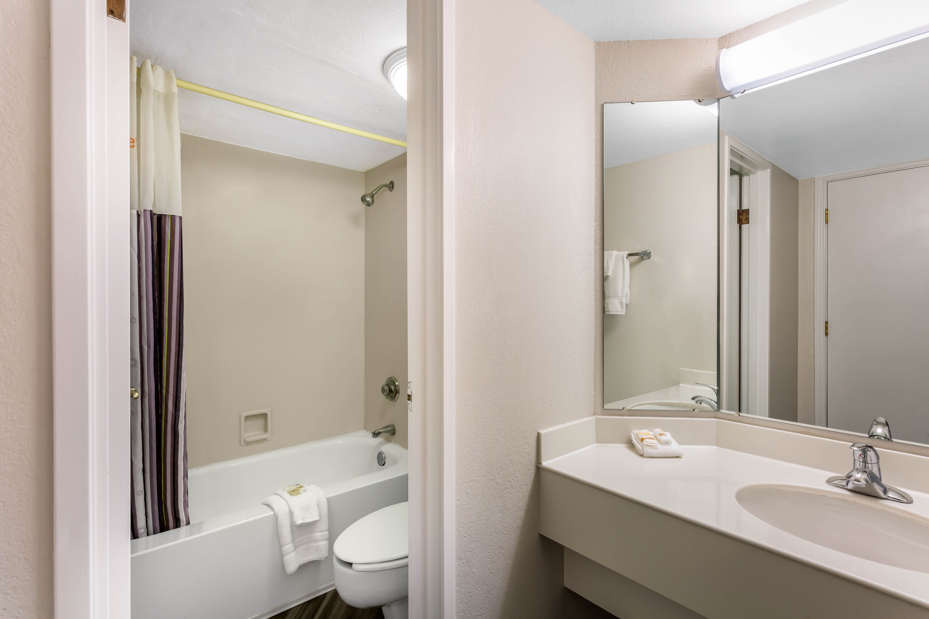 Guest room bath at the La Quinta Inn by Wyndham Odessa in Odessa, Texas