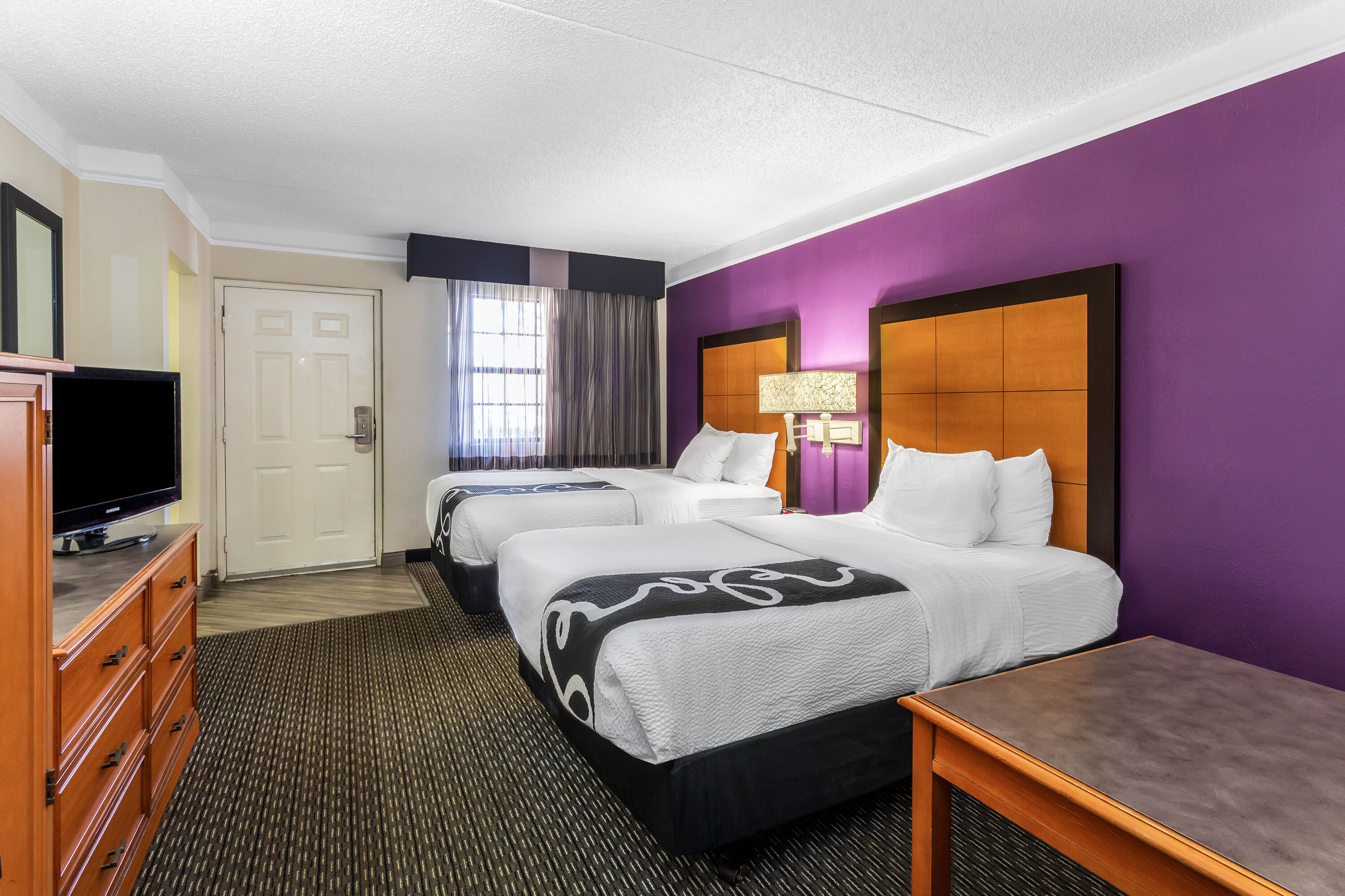 Guest room at the La Quinta Inn by Wyndham Odessa in Odessa, Texas